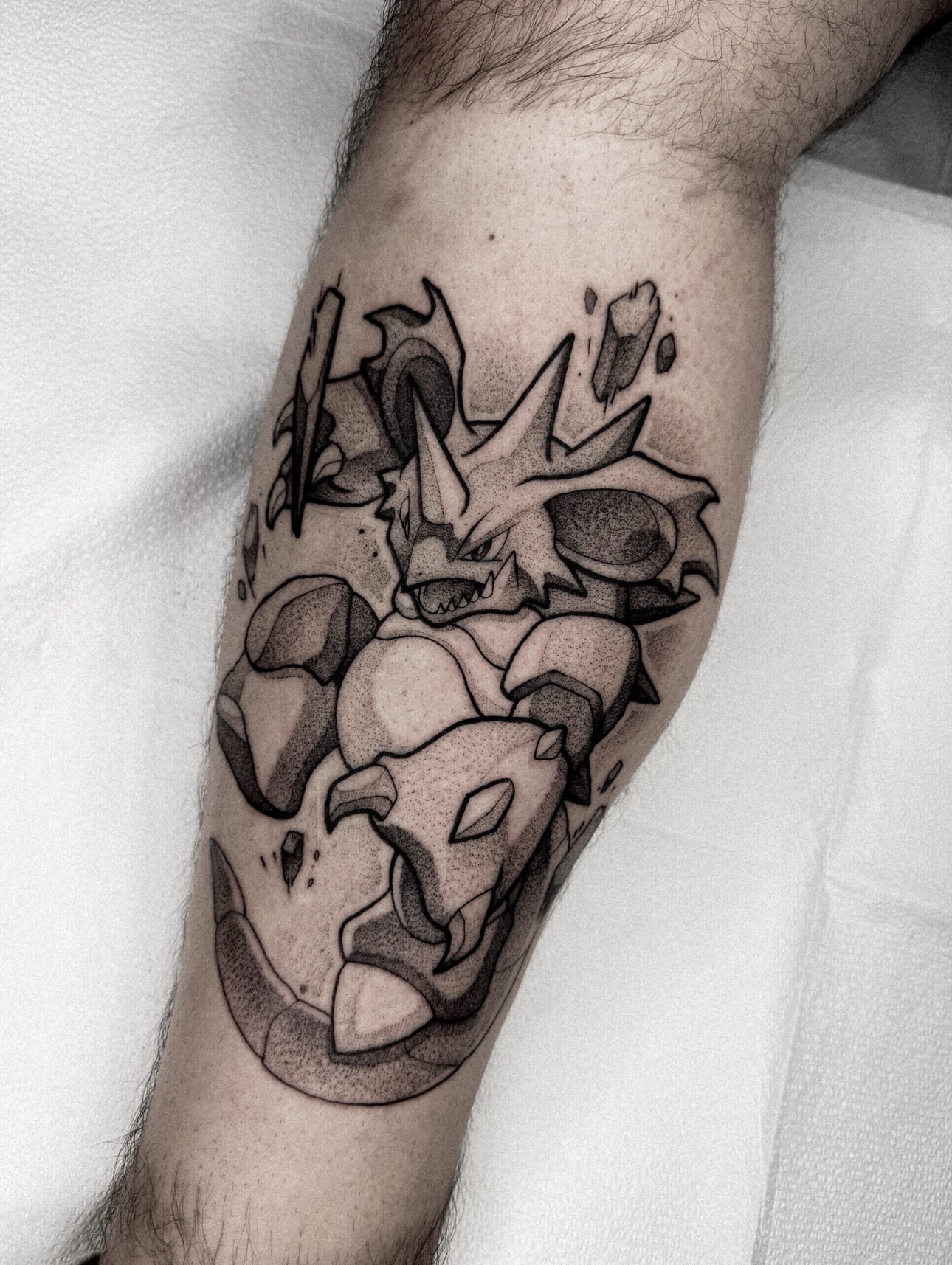 Dragon dotwork tattoo on the forearm by Dane Bezeau