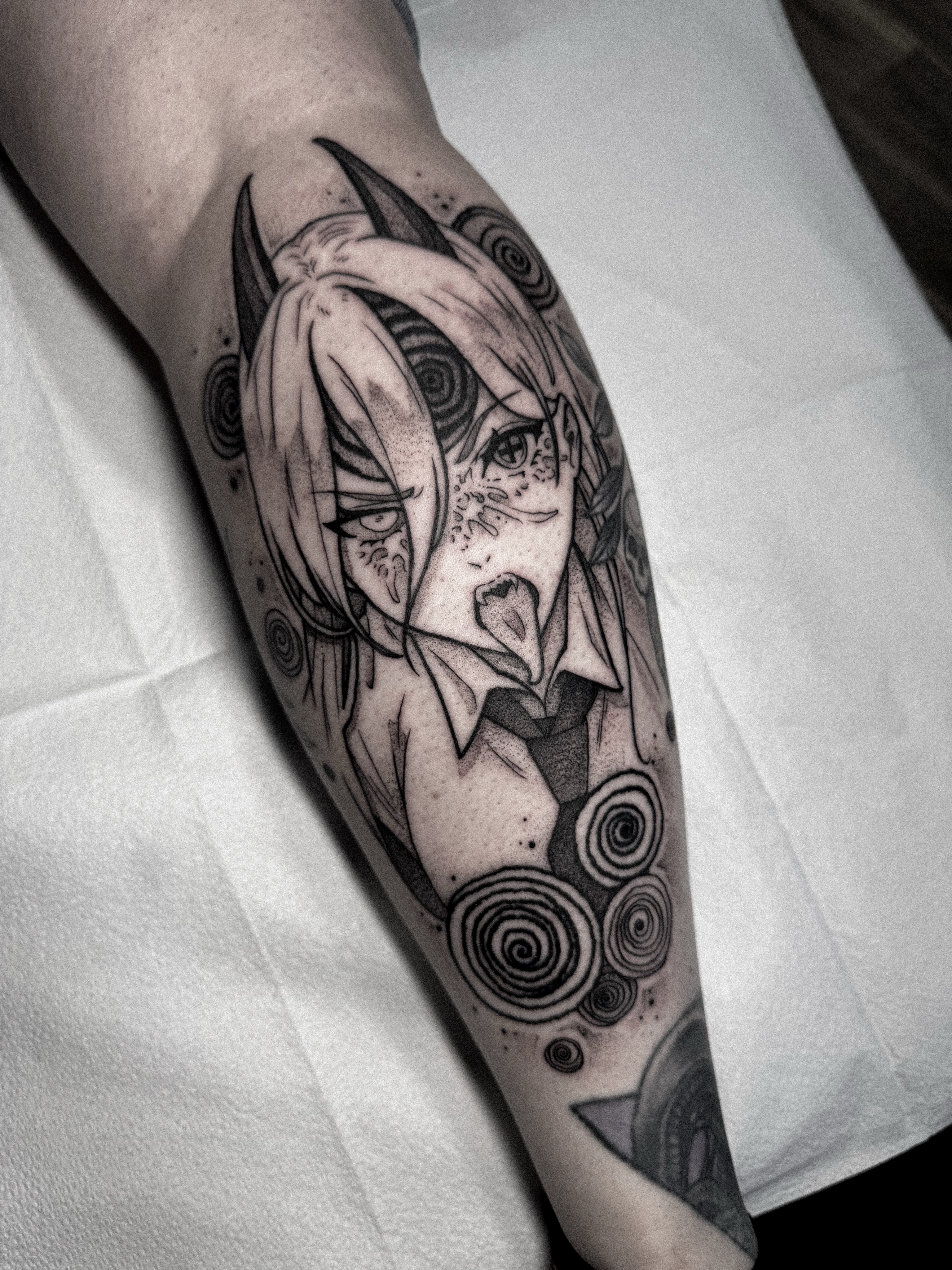 Anime character anime tattoo on the forearm by Dane Bezeau