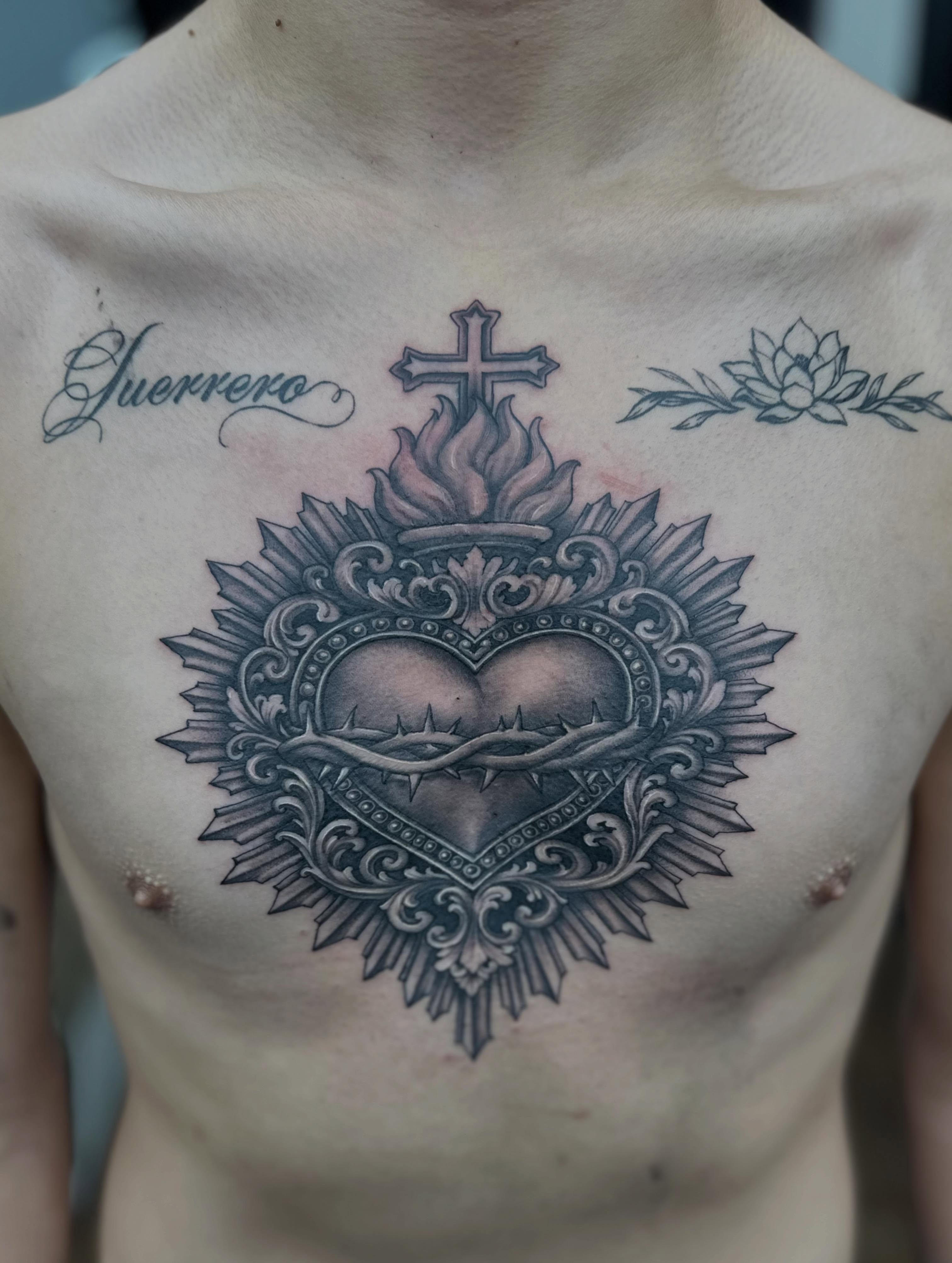 Heart with crown black and grey tattoo on the chest by Ruben