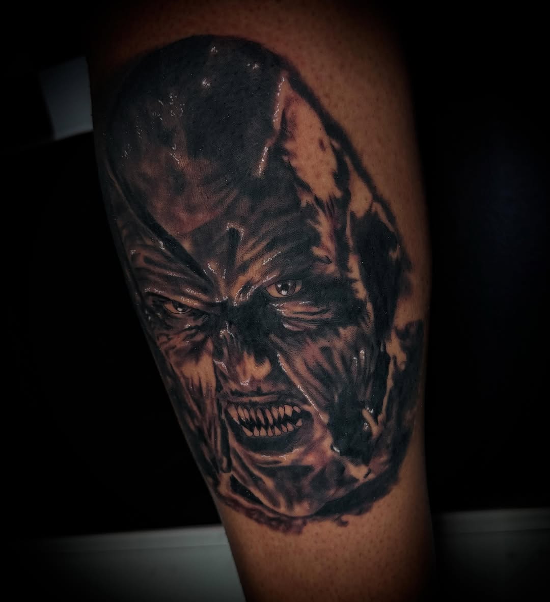 Horror creature dark realism tattoo on the forearm by Savannah Duff