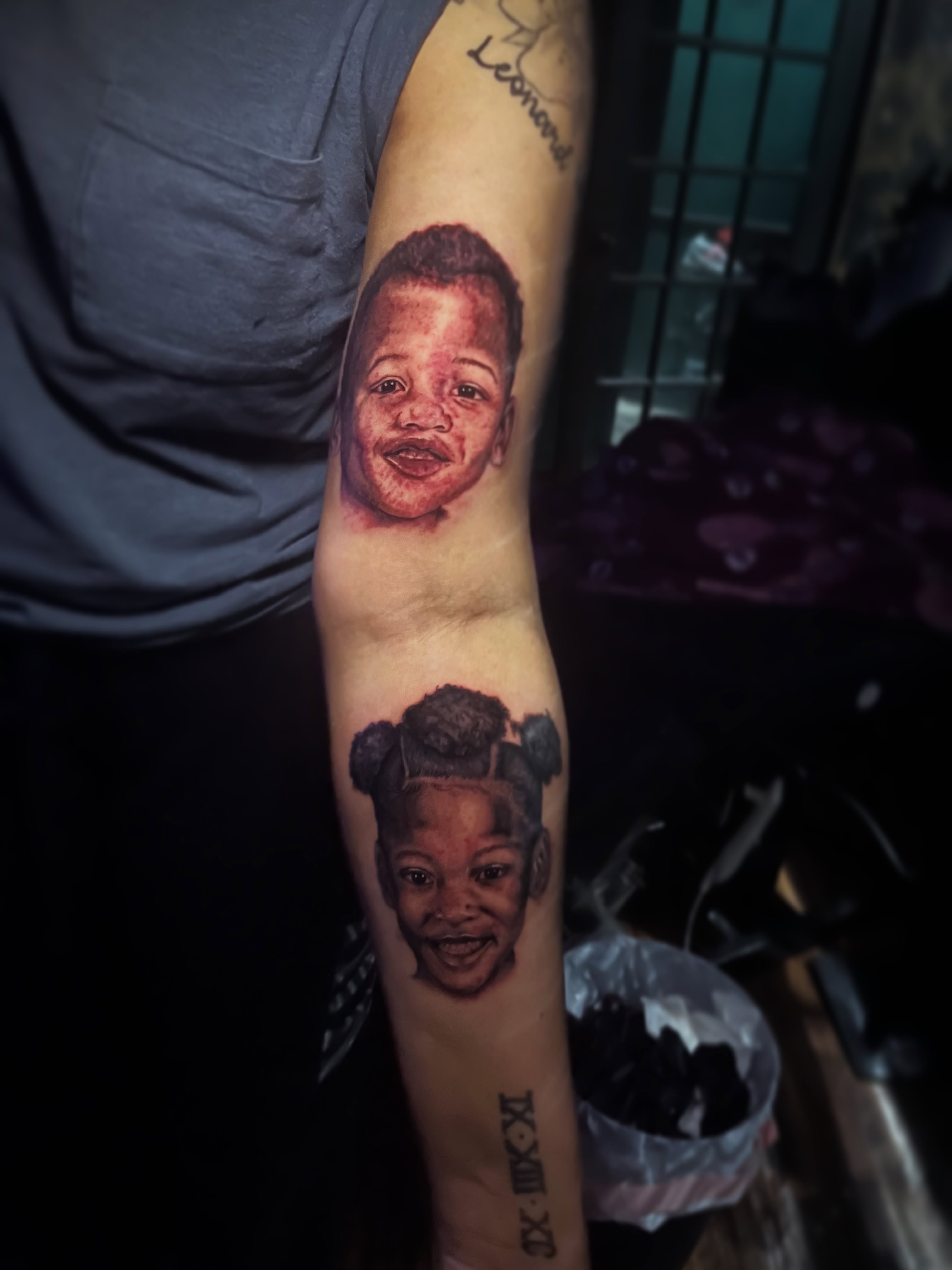 Portrait realism tattoo on the forearm by Christa Martinez