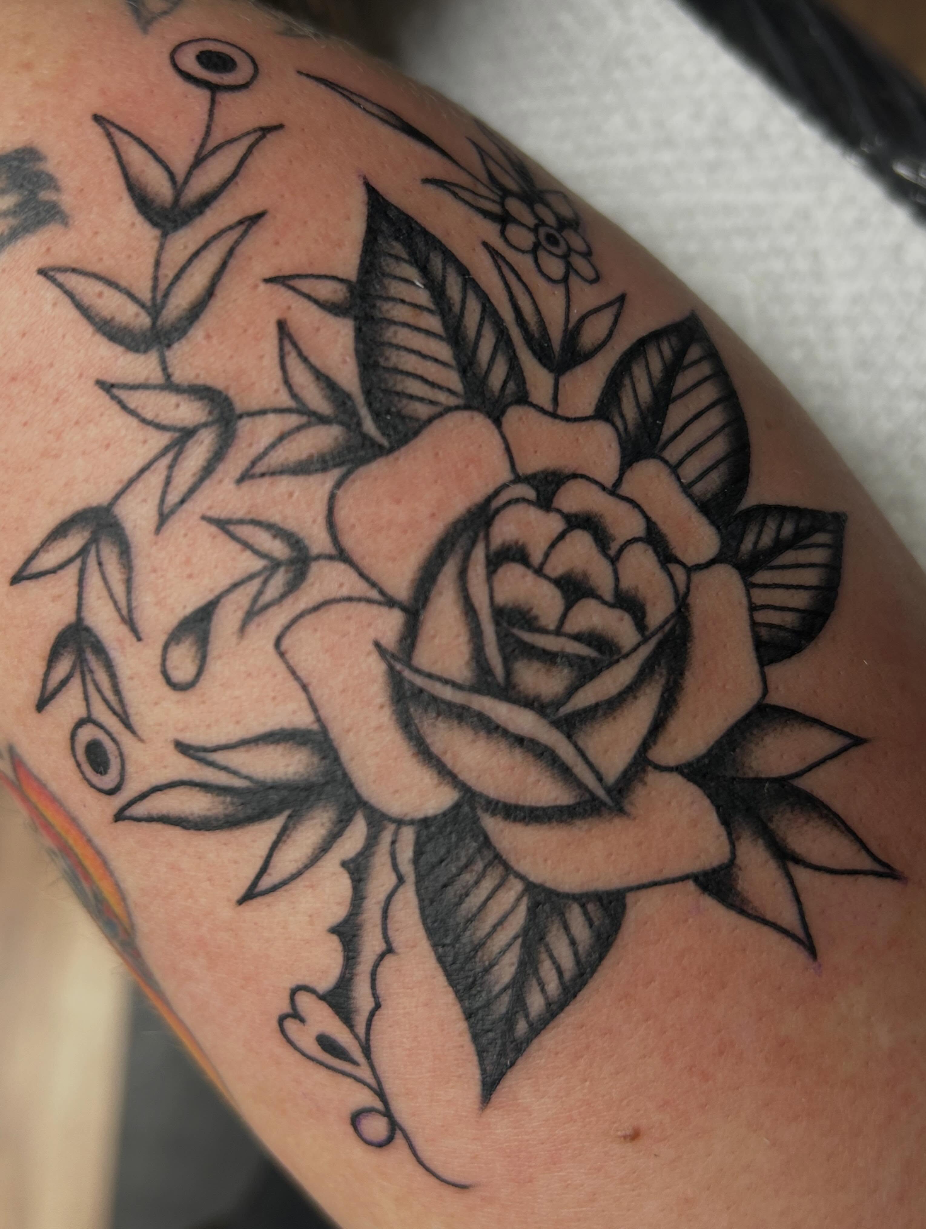 Rose American traditional tattoo on the forearm by Tiffany Vargas
