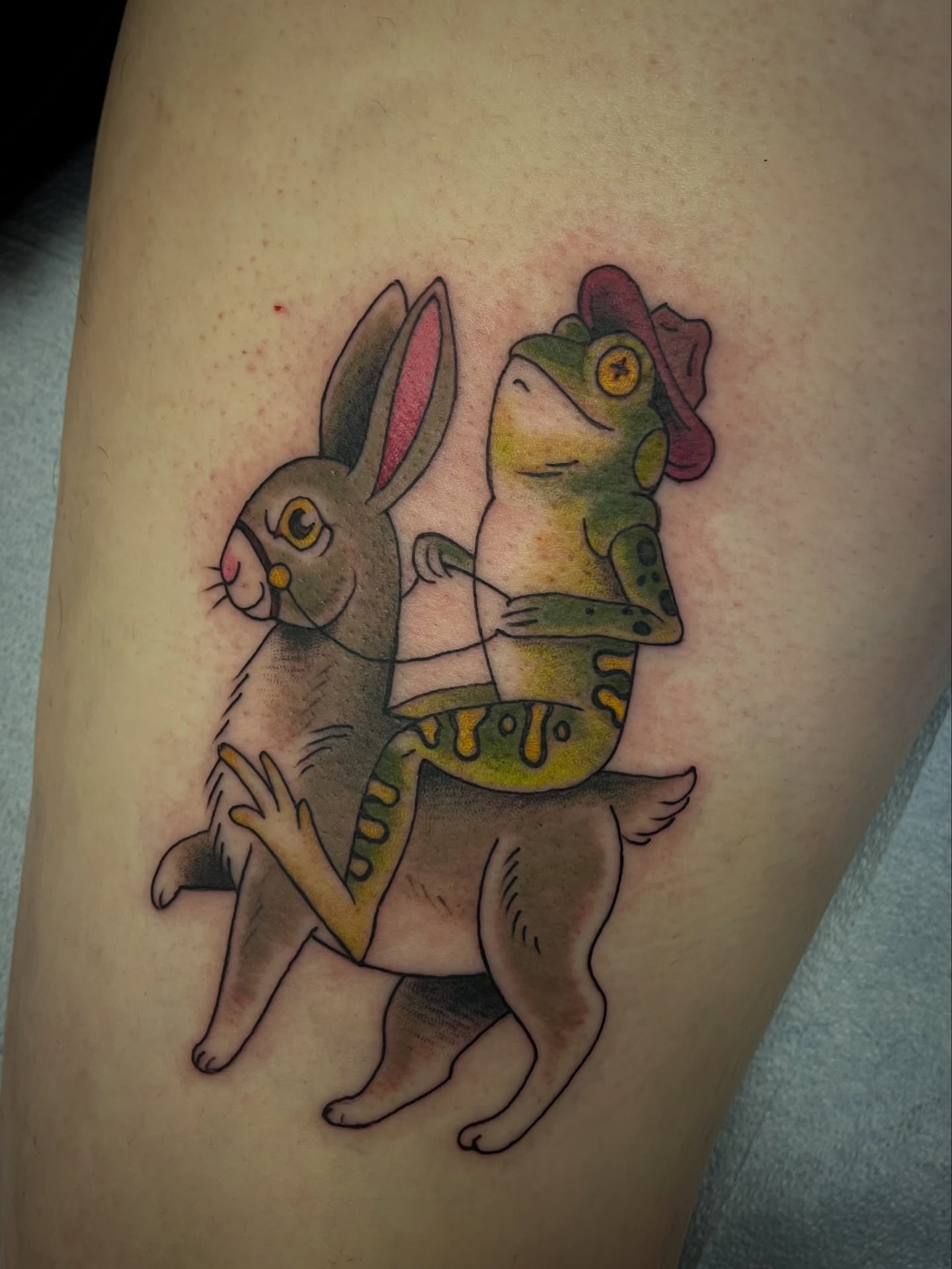 Rabbit and frog American traditional tattoo on the thigh by Lacey B, Portland, Oregon