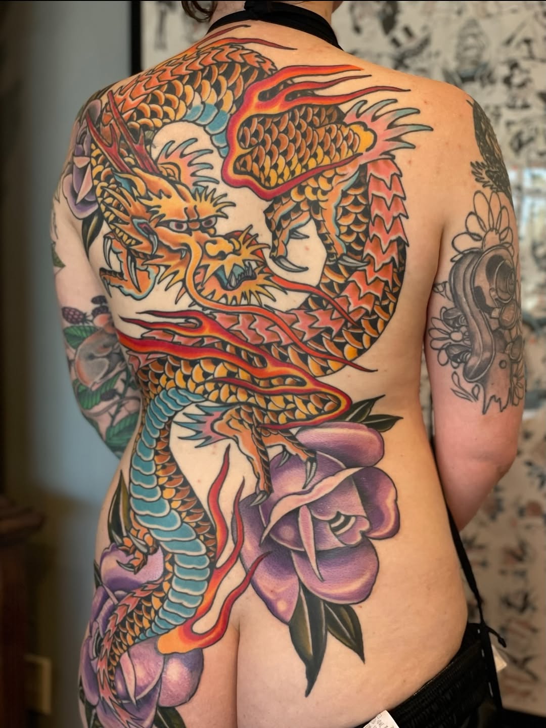 Dragon and flowers Japanese tattoo on the back by Brian Hutflies