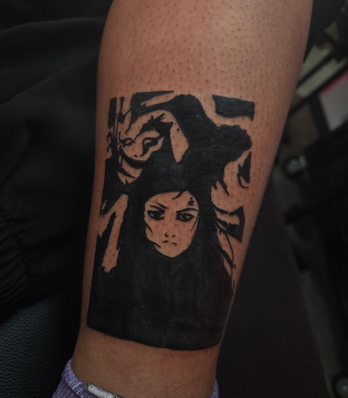 Anime character anime tattoo on the forearm by Lane
