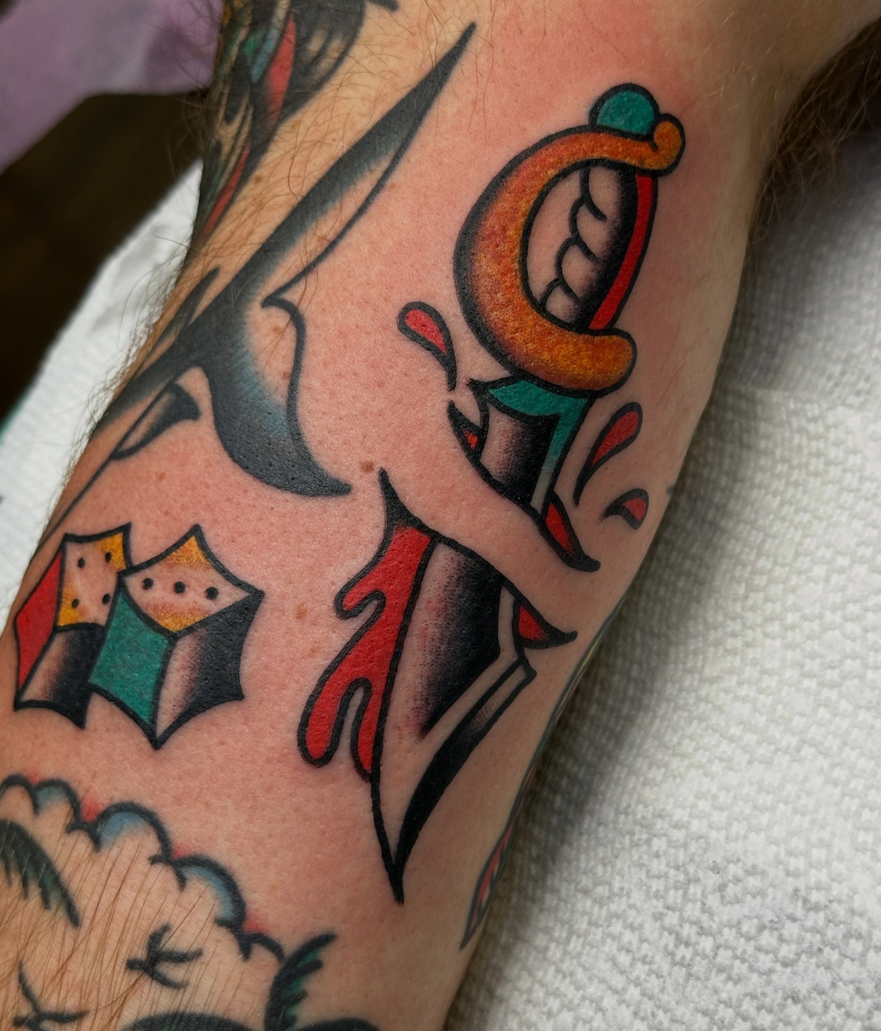 Letter 'C' with dagger American traditional tattoo on the forearm by Amanda Bonhomme, Las Vegas, Nevada