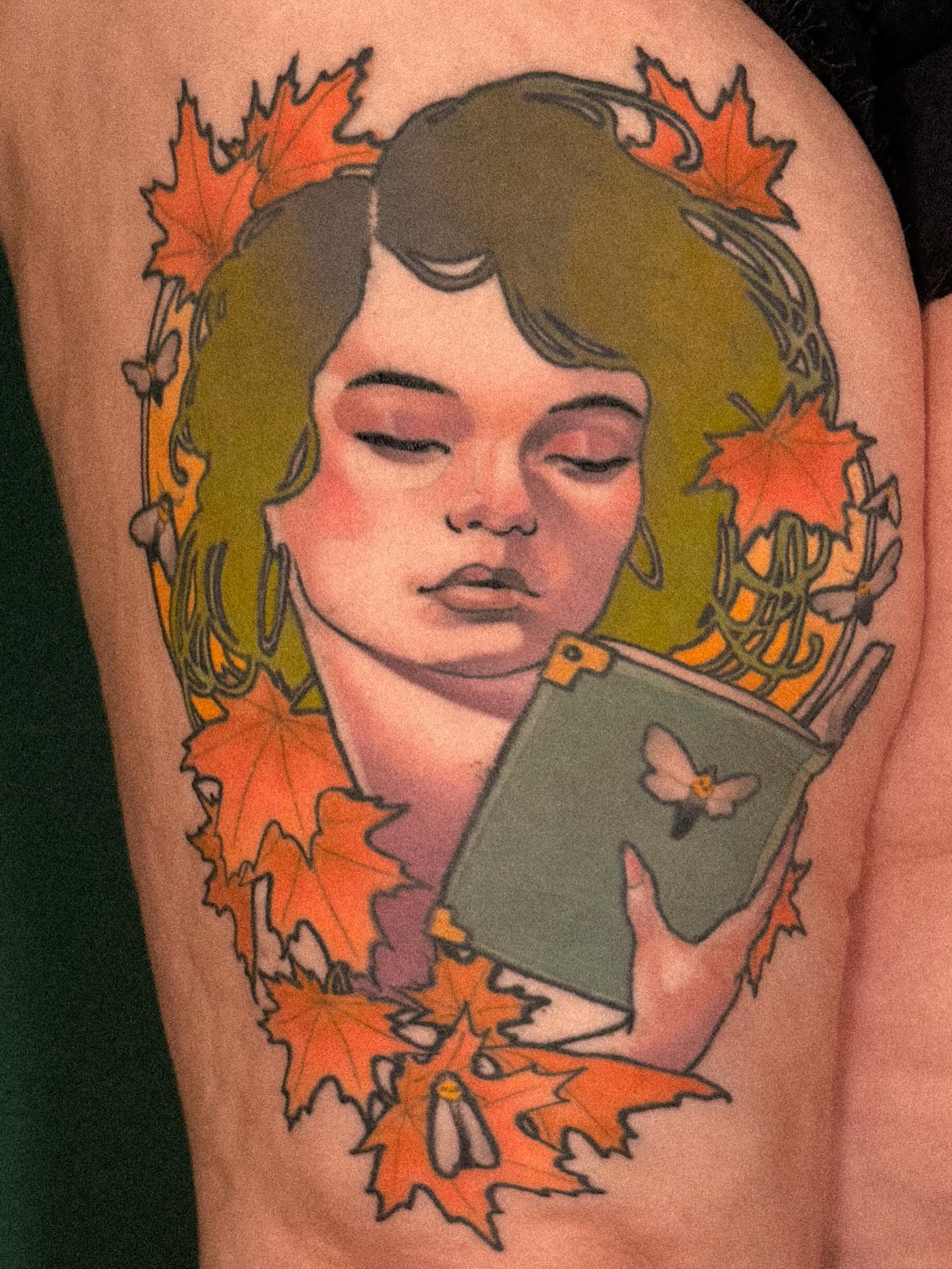 Autumn portrait illustrative tattoo on the upper arm by Nathan Thomas