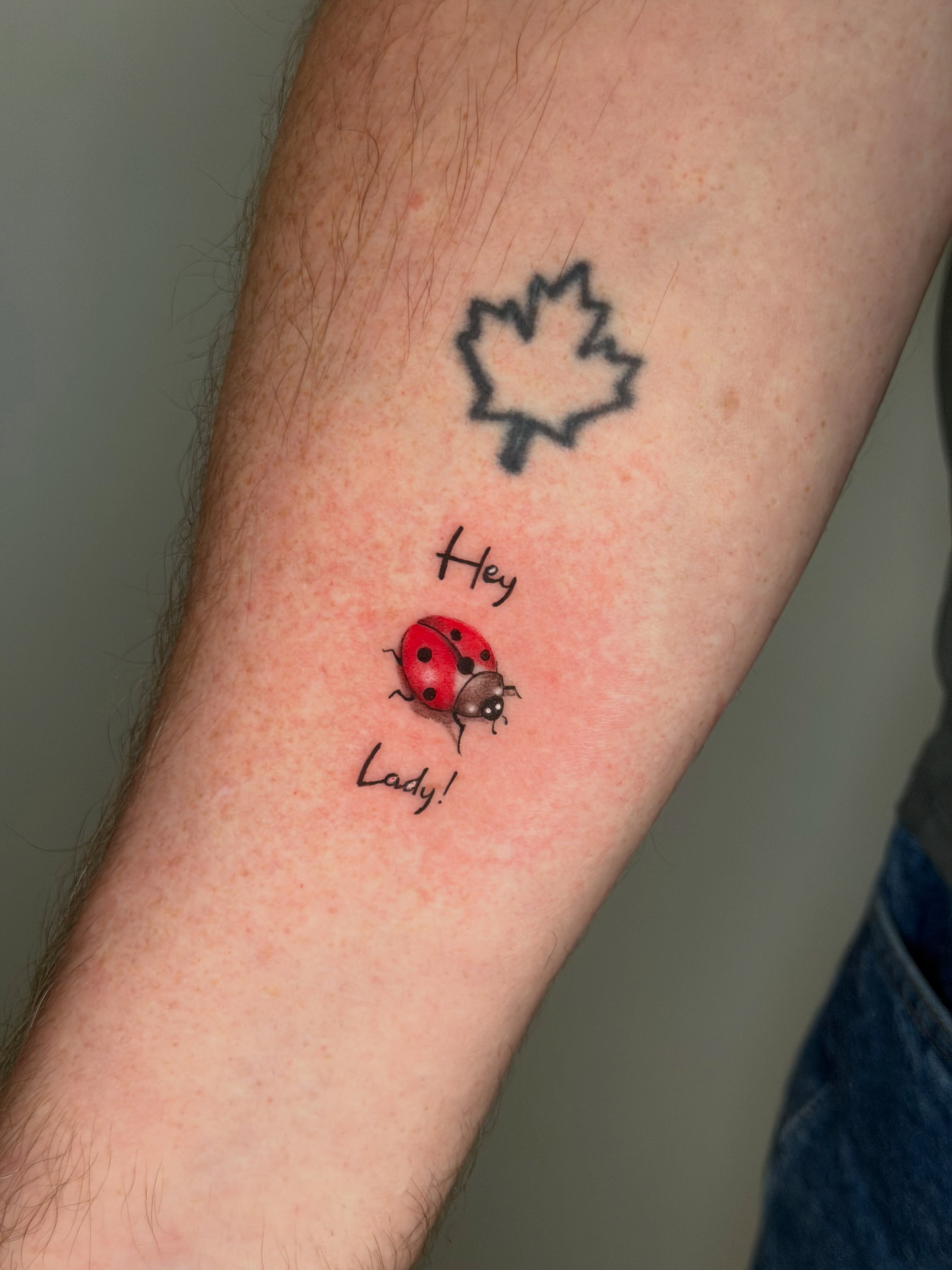 Ladybug realism tattoo on the forearm by Mandy Kaur