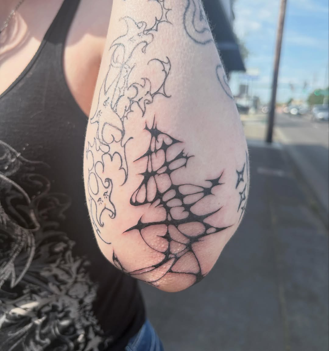Abstract web-like design cyber sigilism tattoo on the forearm by izzy solae