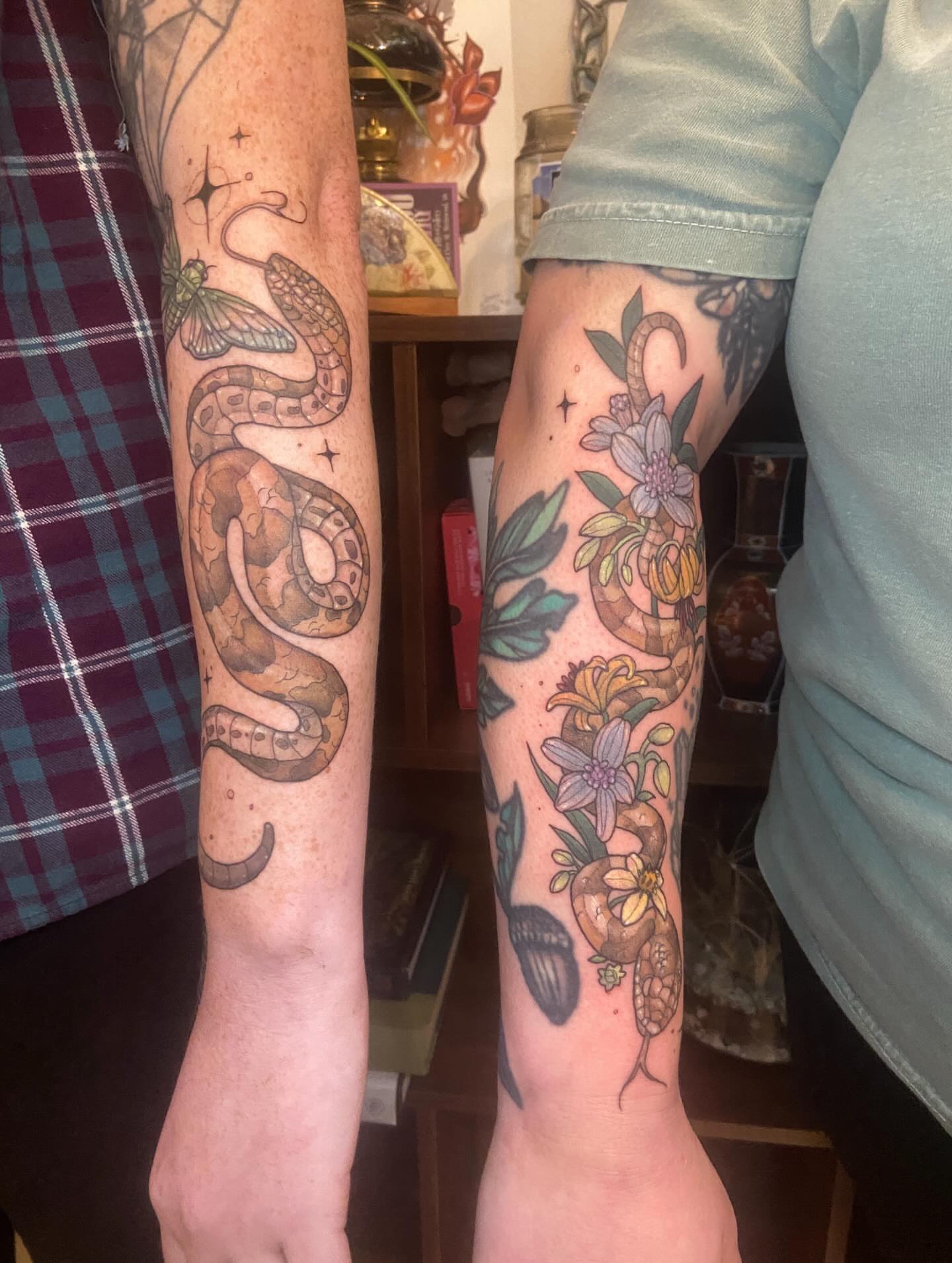 Snake and flowers realism tattoo on the forearm by Dawn Carr, Richmond, Virginia