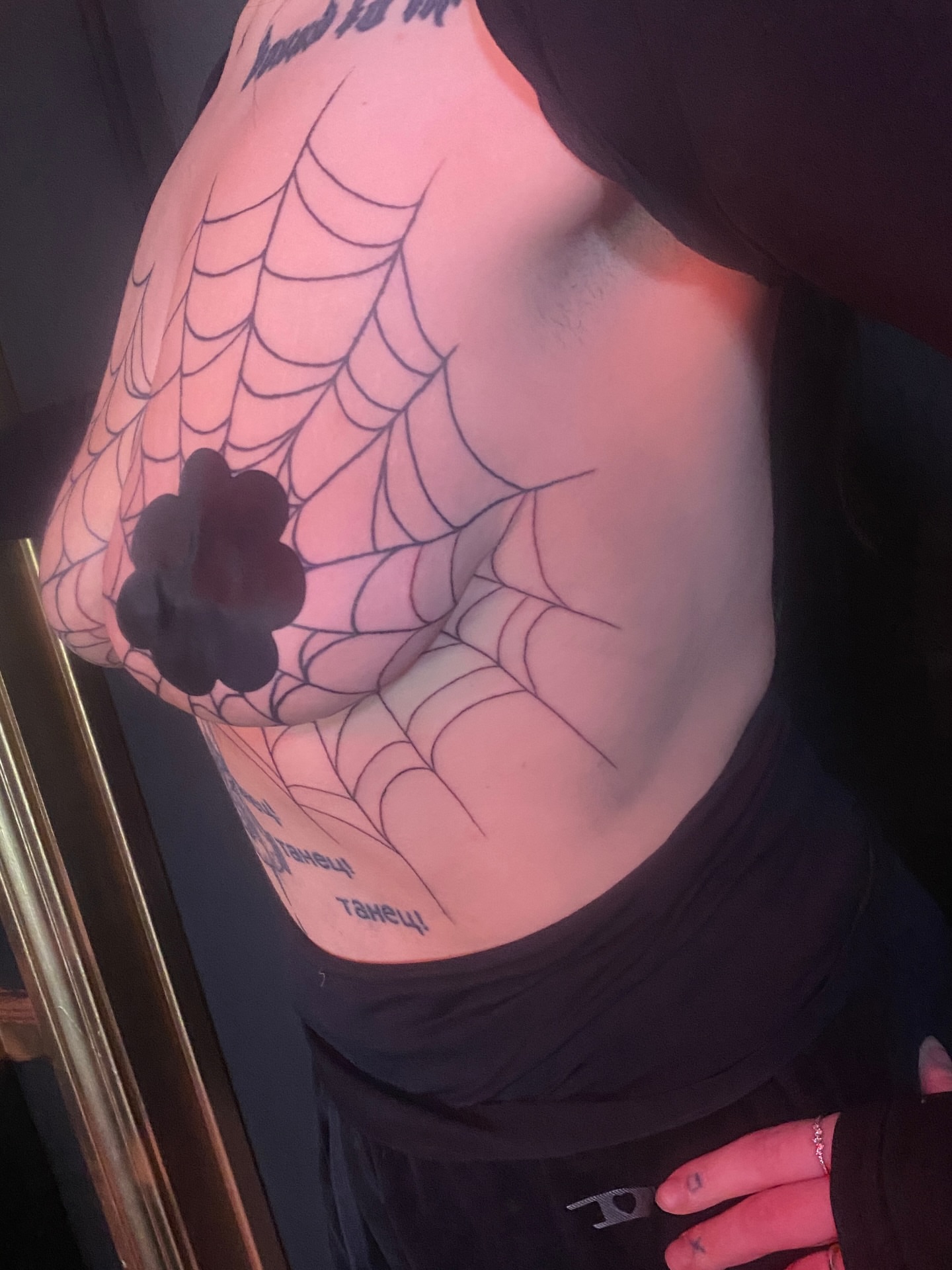Spiderweb black and grey tattoo on the chest by Elliot Jaye Valentine