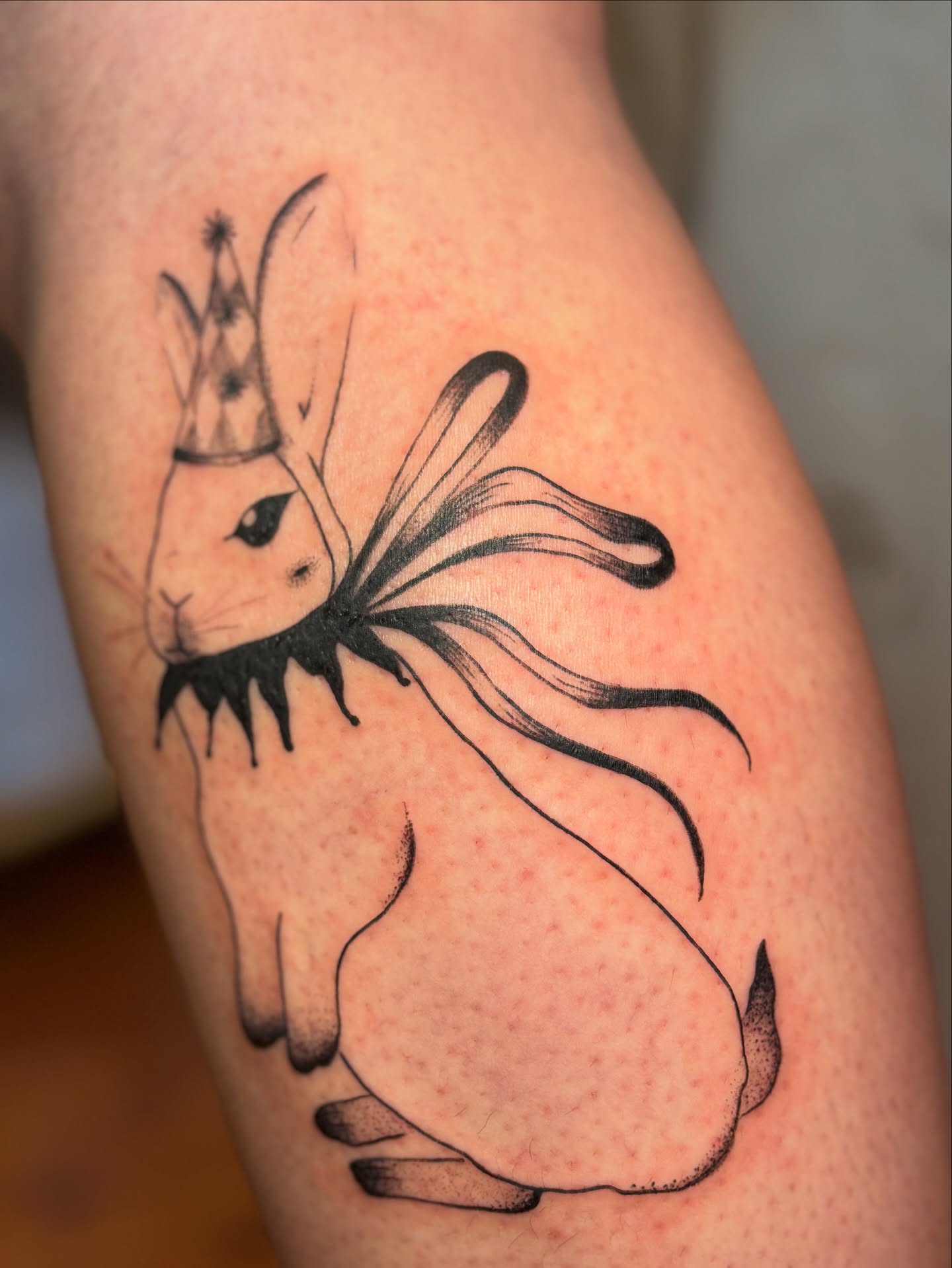 Rabbit with crown dotwork tattoo on the thigh by carla sofia