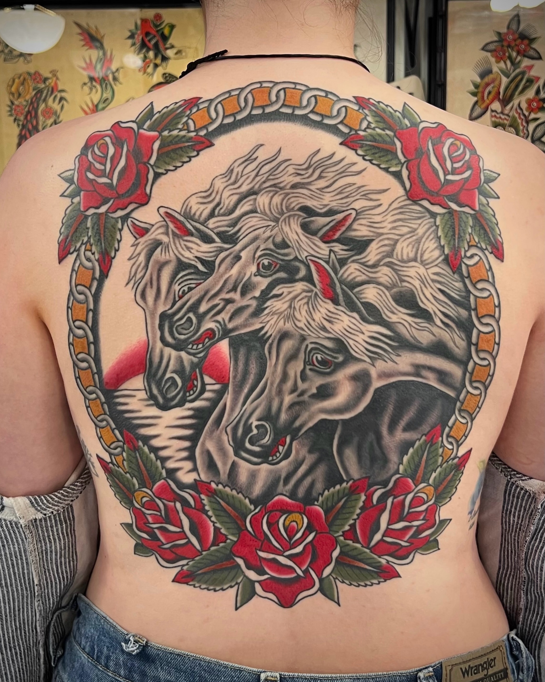 Horses and roses American traditional tattoo on the back by Brian Visser