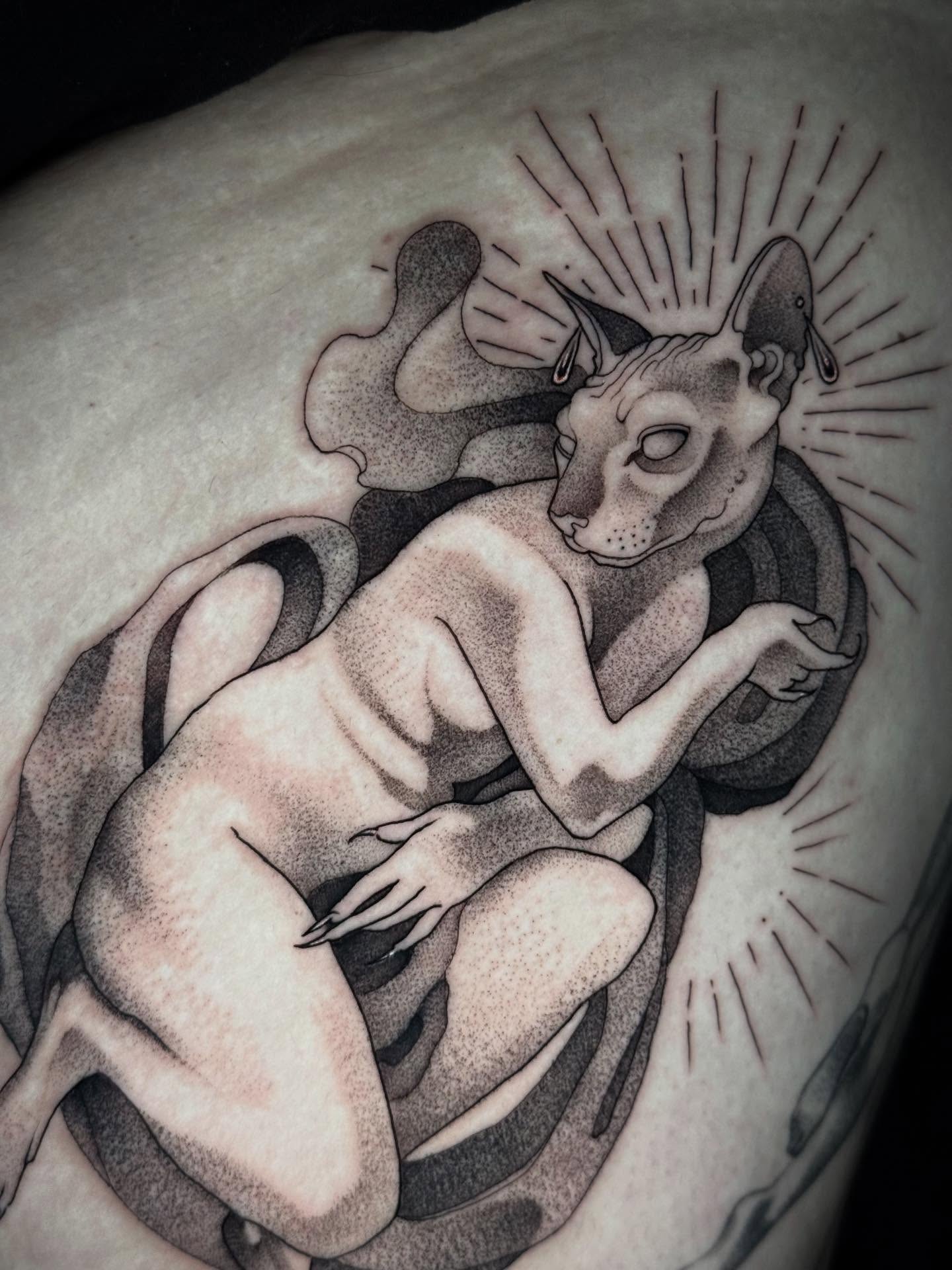 Cat woman dotwork tattoo on the shoulder by Mads Ink