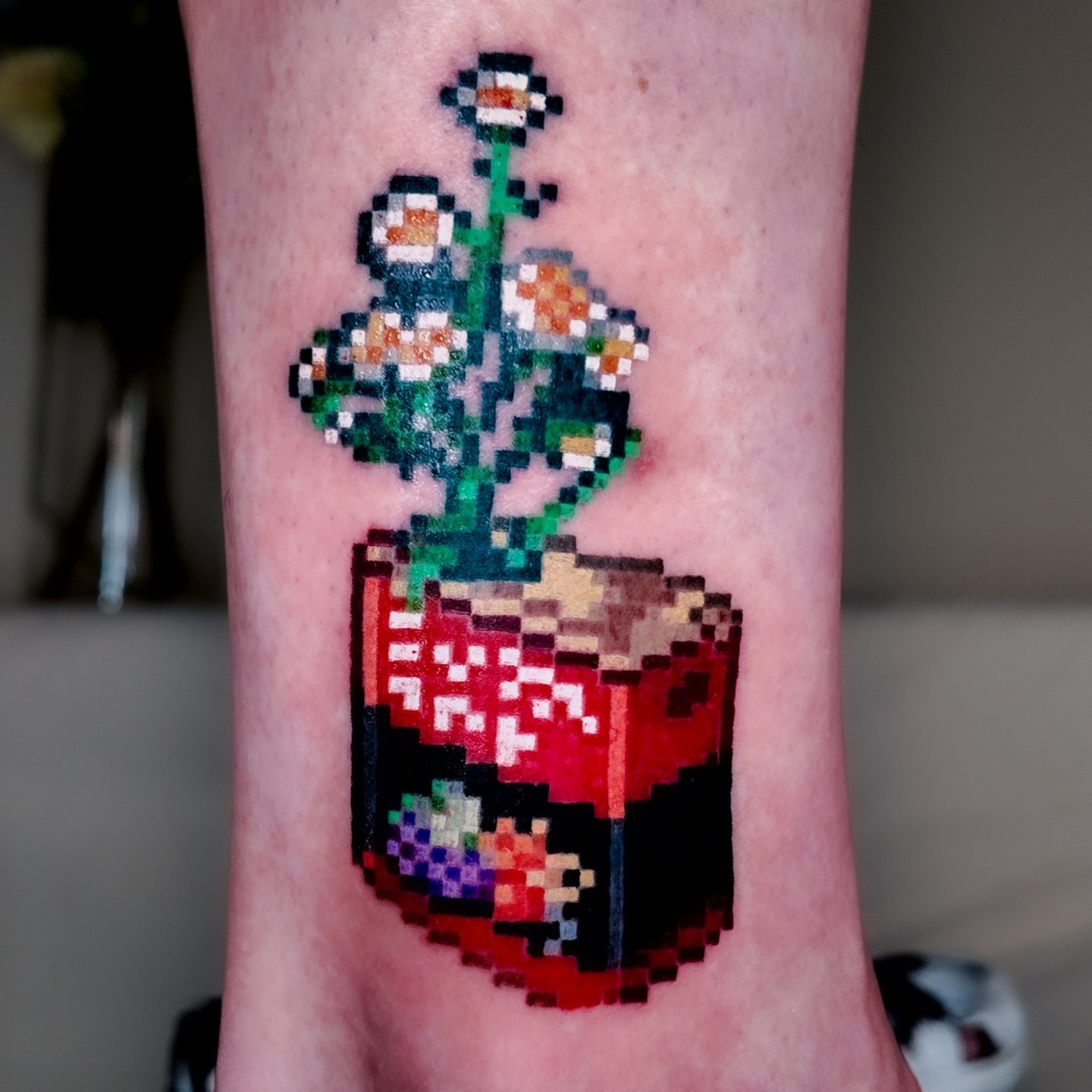 Pixelated plant dotwork tattoo on the forearm by m r p i x e l ๐ธ๐ฌ