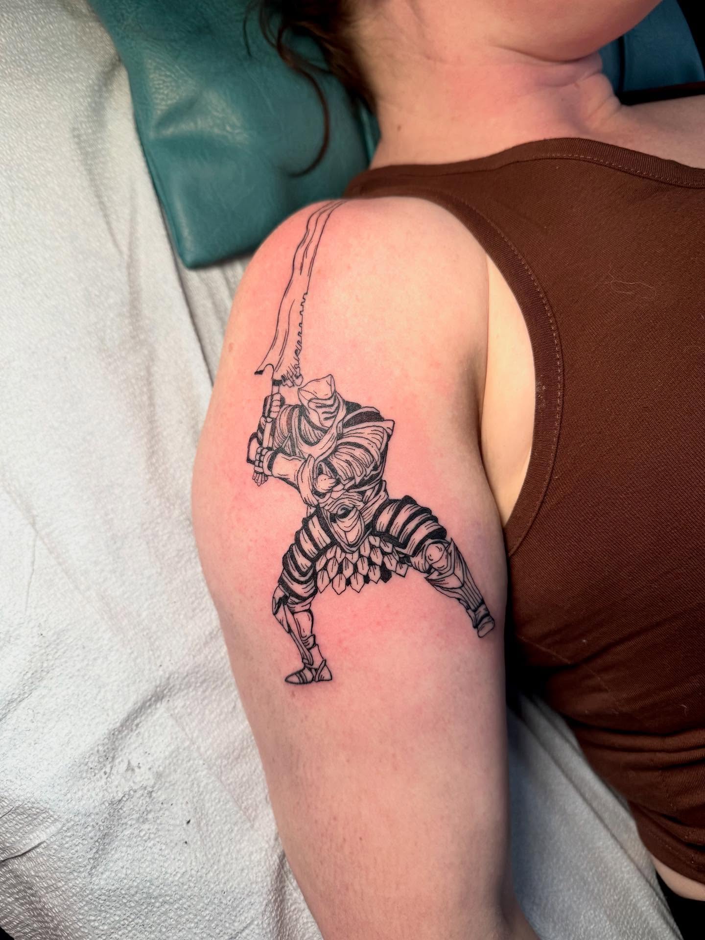 Robotic warrior black and grey tattoo on the shoulder by C.J. Pennington
