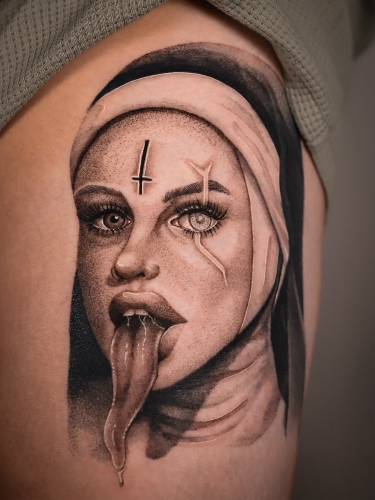 Nun with snake tongue dark realism tattoo on the thigh by Cyn