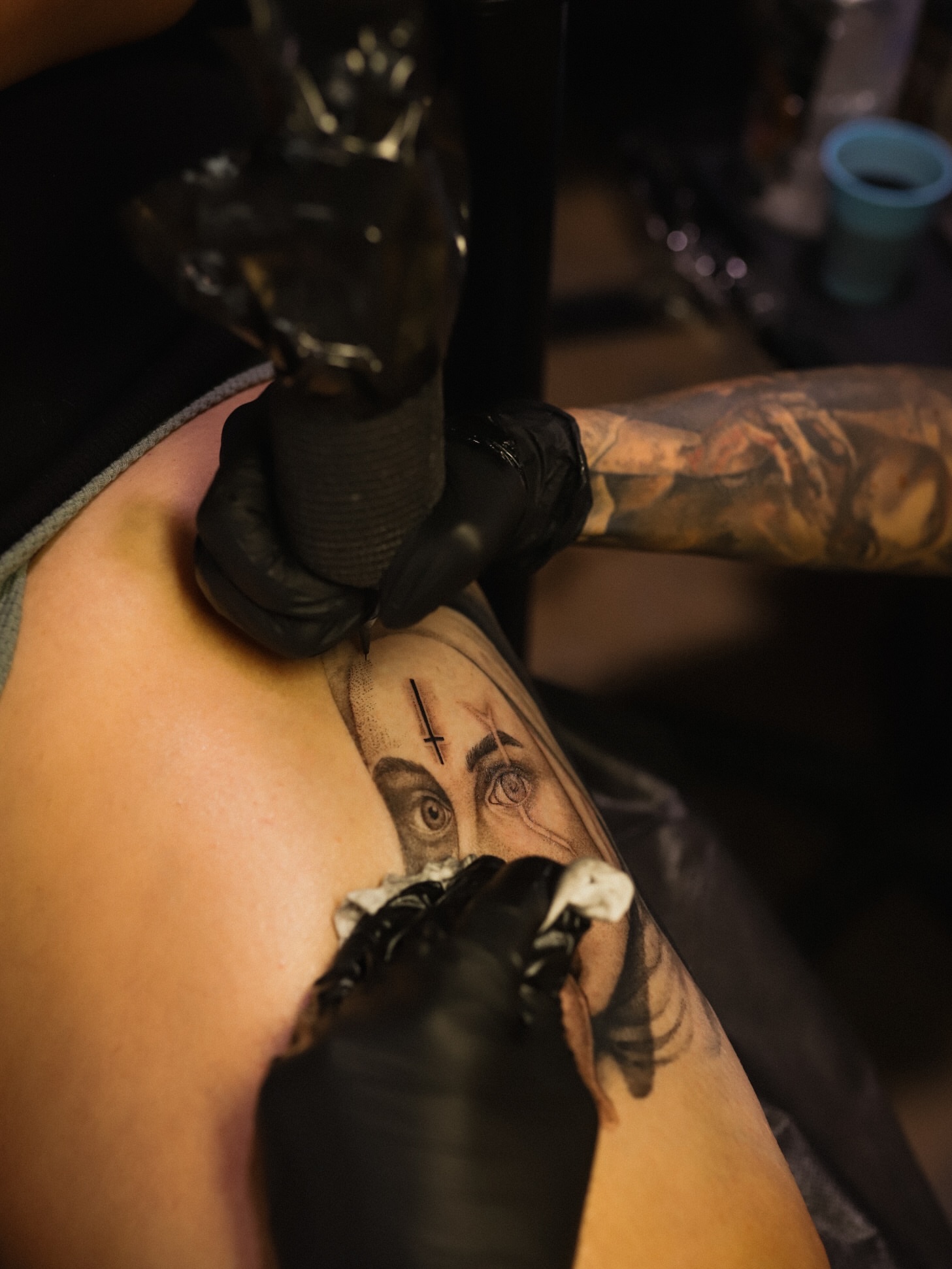 Eye with cross realism tattoo on the forearm by Cyn
