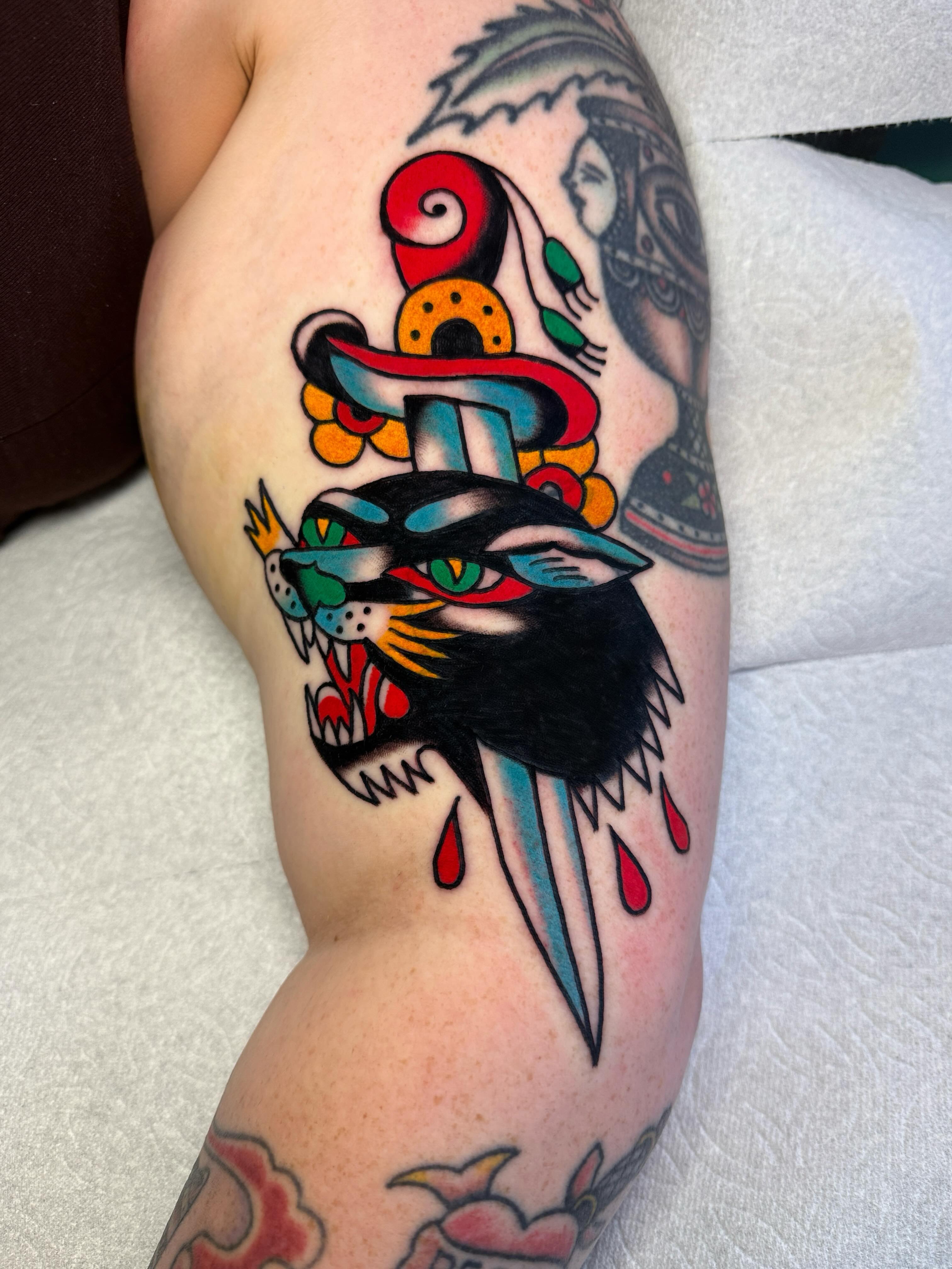 Hat and bird American traditional tattoo on the forearm by Britt Kuechenmeister, Culver City, California