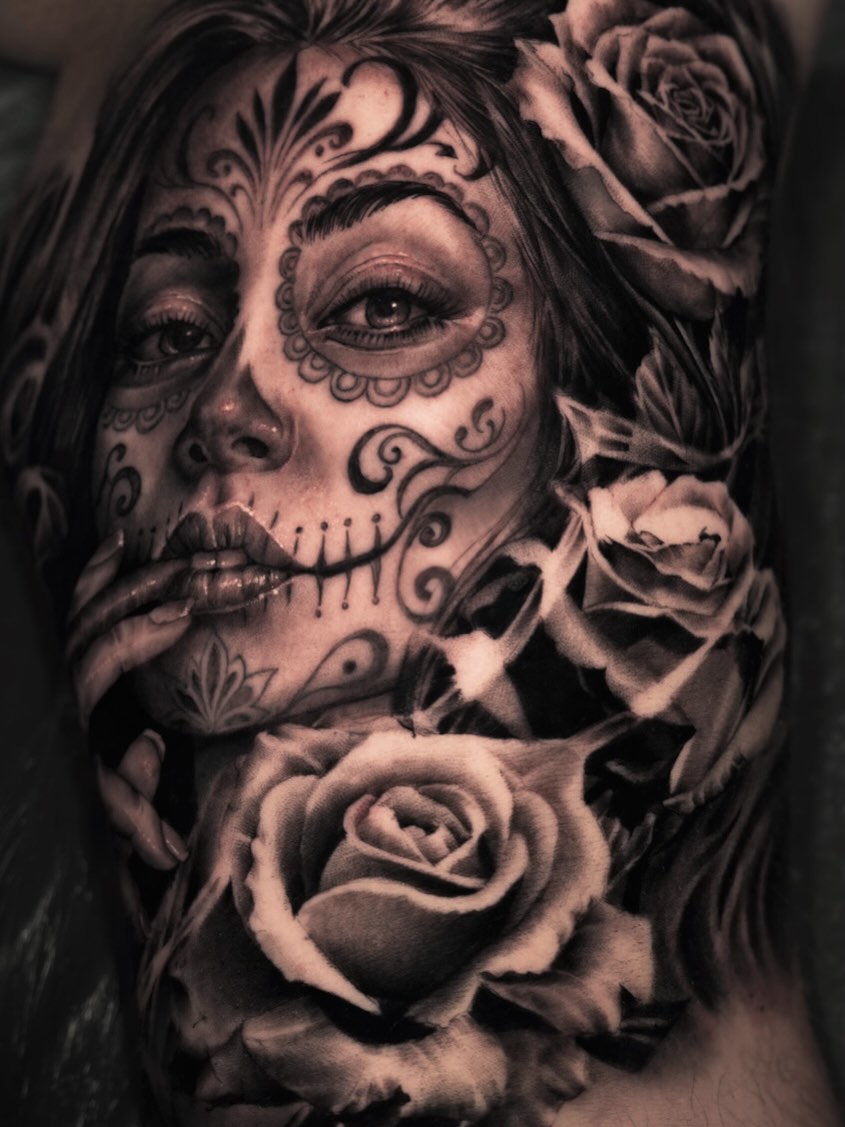 Sugar skull woman with roses realism tattoo on the forearm by Pitasso tattoo black and grey