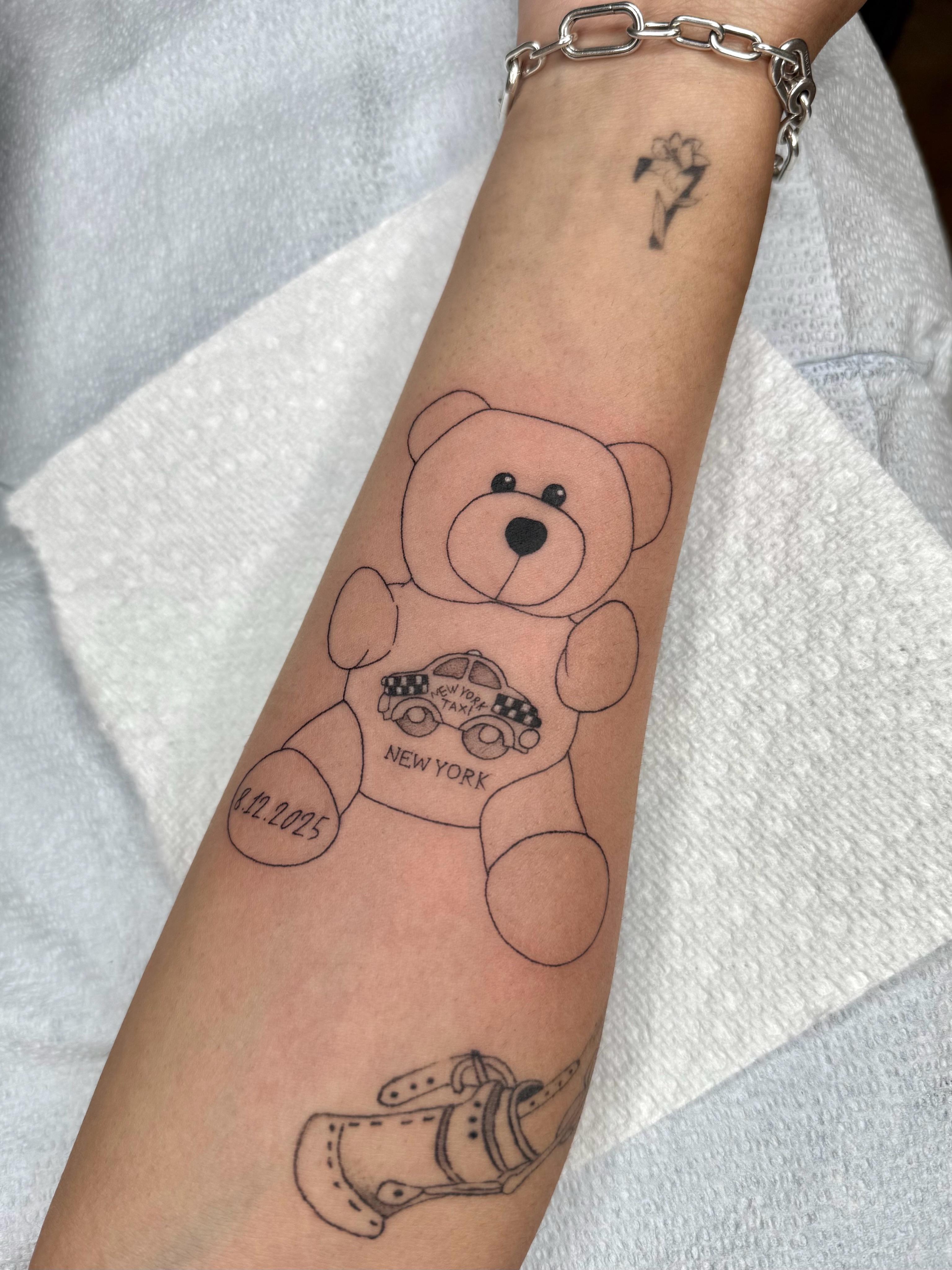 Teddy bear black and grey tattoo on the forearm by ๐๐๐๐๐๐