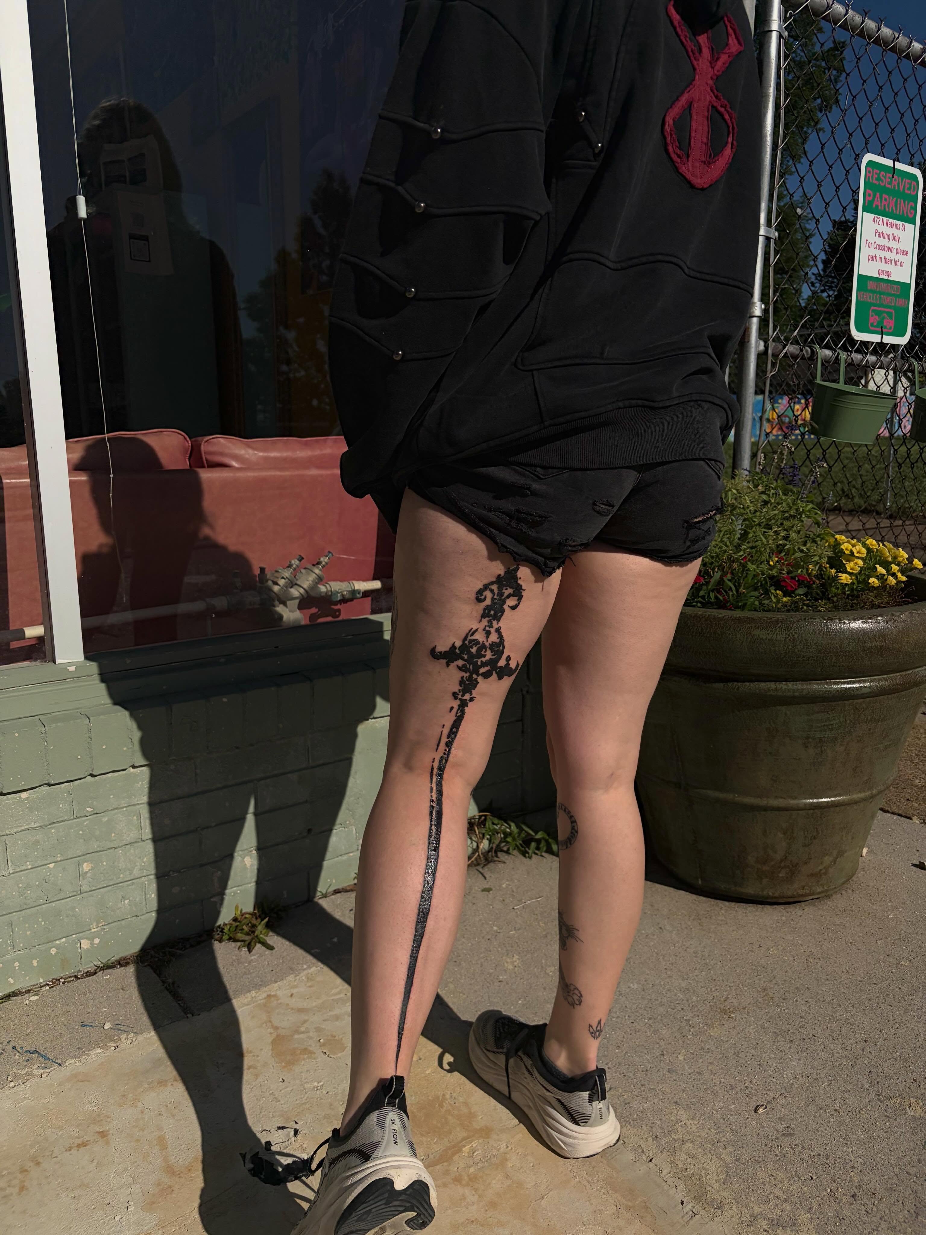 Floral vine black and grey tattoo on the leg by neal
