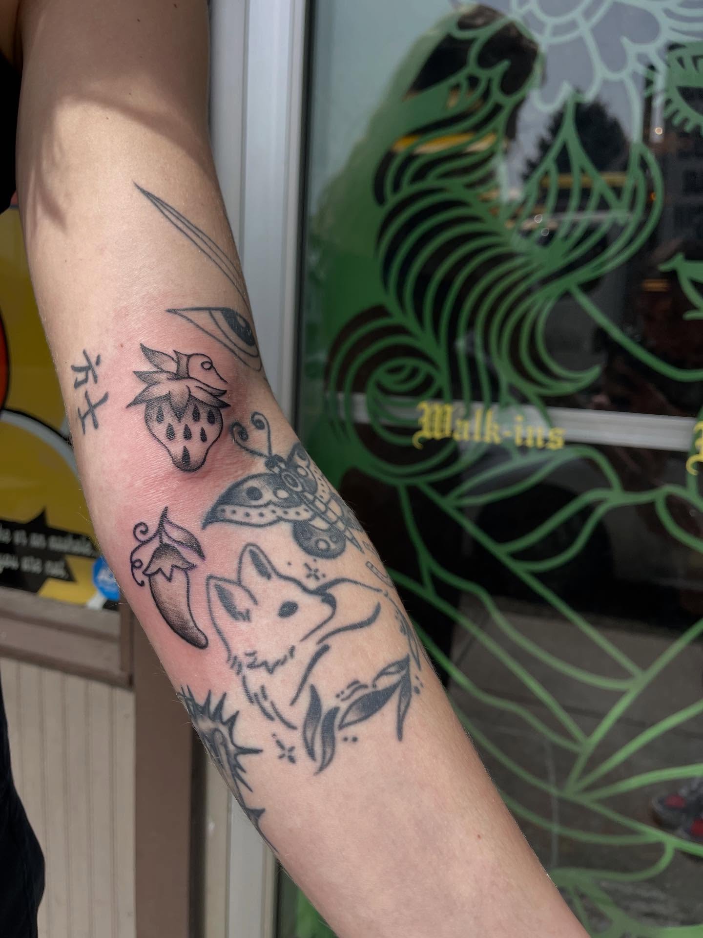 Fox and strawberry black and grey tattoo on the forearm by J❄️, Portland, Oregon