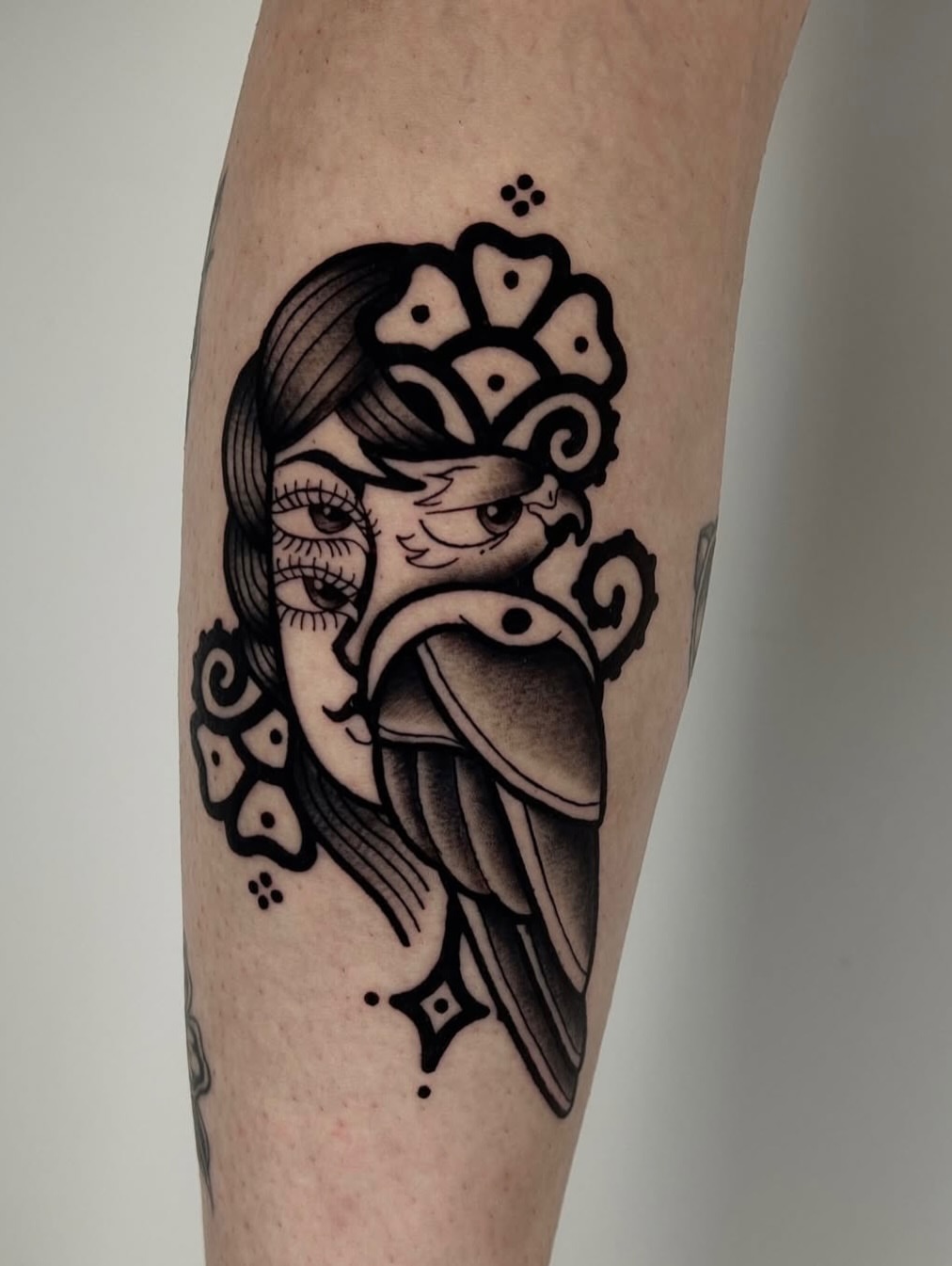 Woman with bird American traditional tattoo on the forearm by Rebel milly Tattoo