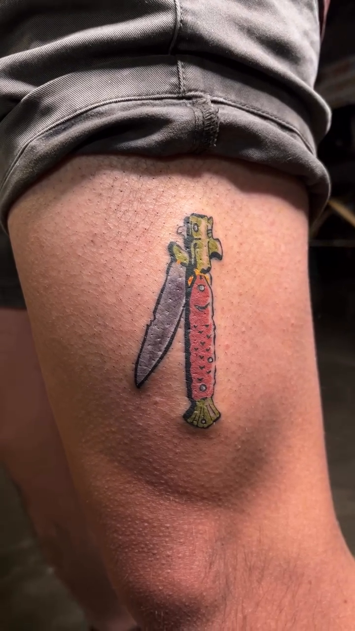 Two knives crossed American traditional tattoo on the leg by Brooke Elayne