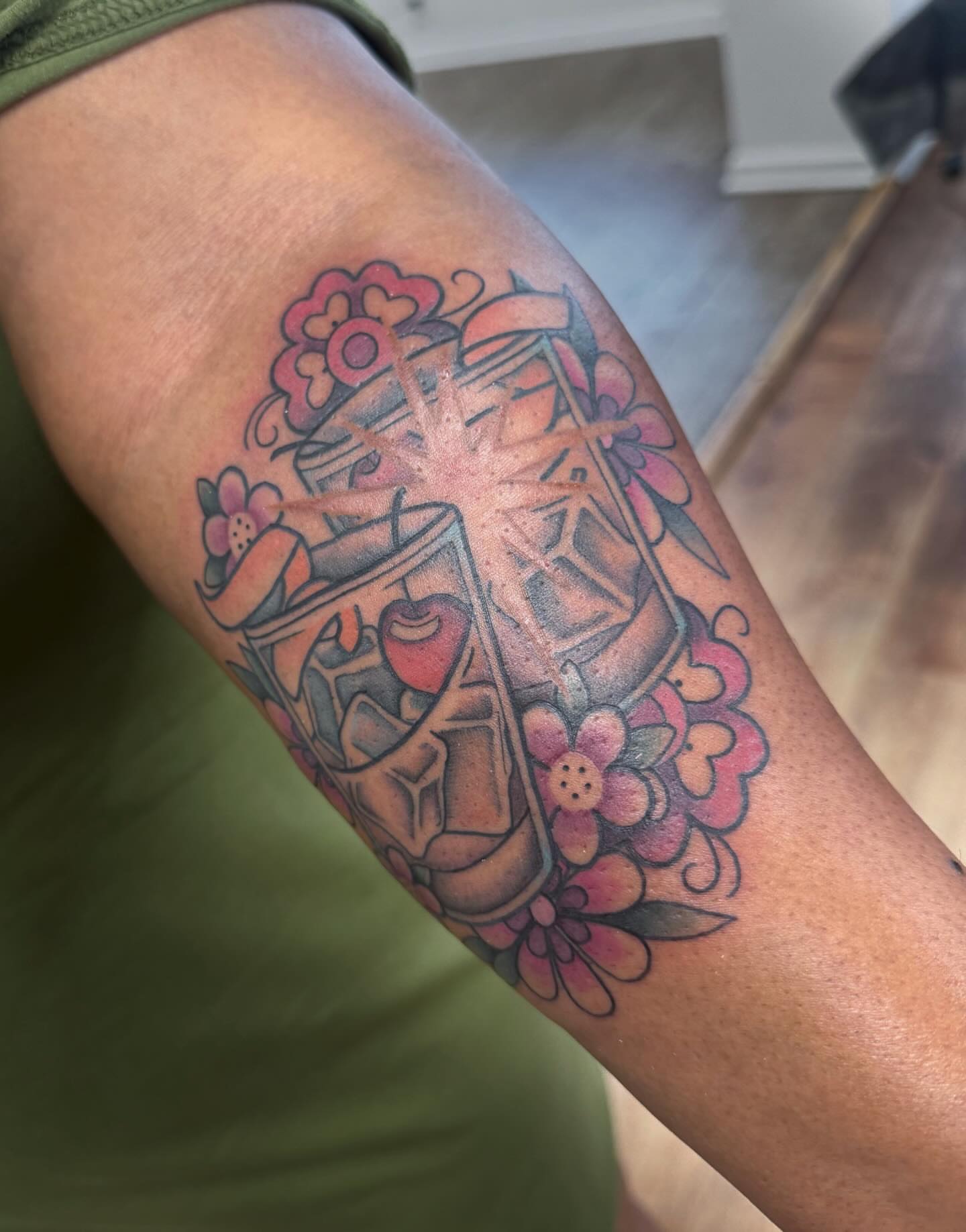 Mechanical device with flowers American traditional tattoo on the forearm by rocky love