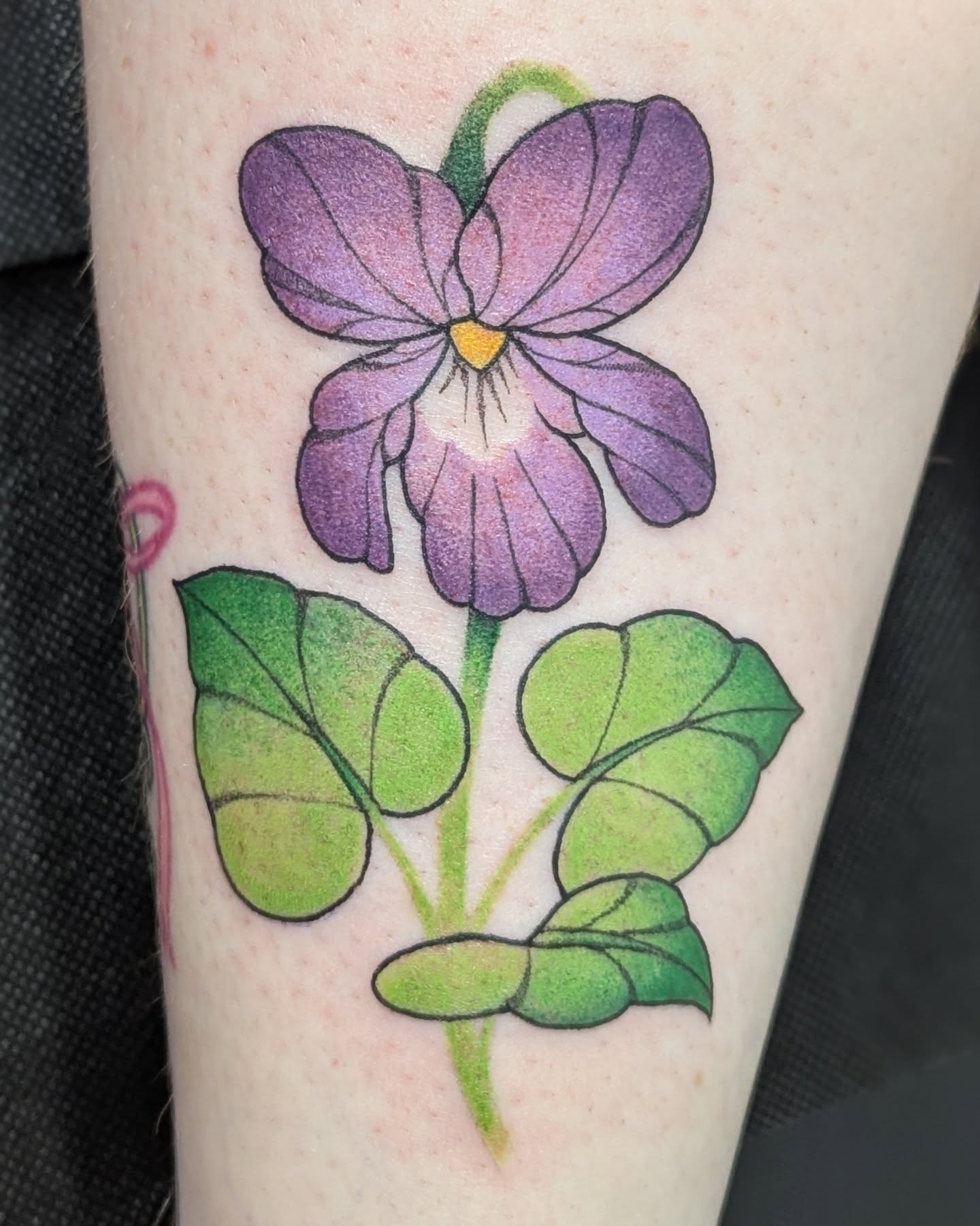 Purple flower realism tattoo on the forearm by Spencer Jennings, Westland, Michigan