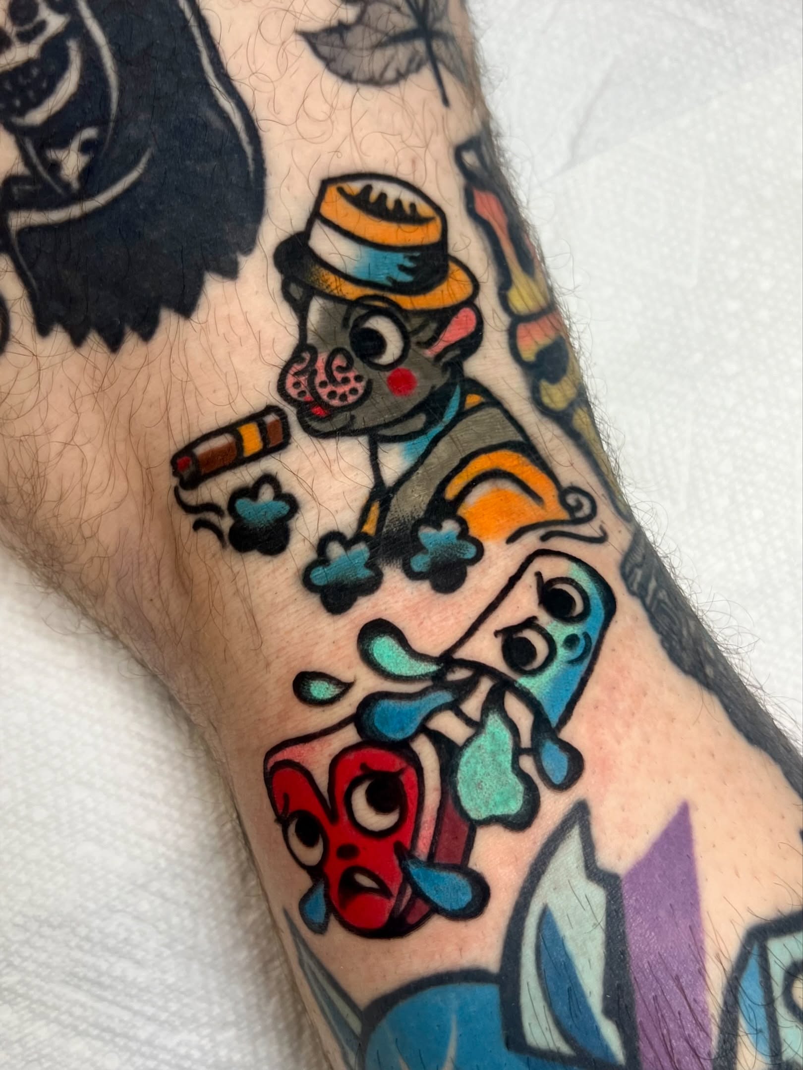Joker smoking American traditional tattoo on the forearm by Sierra Mack