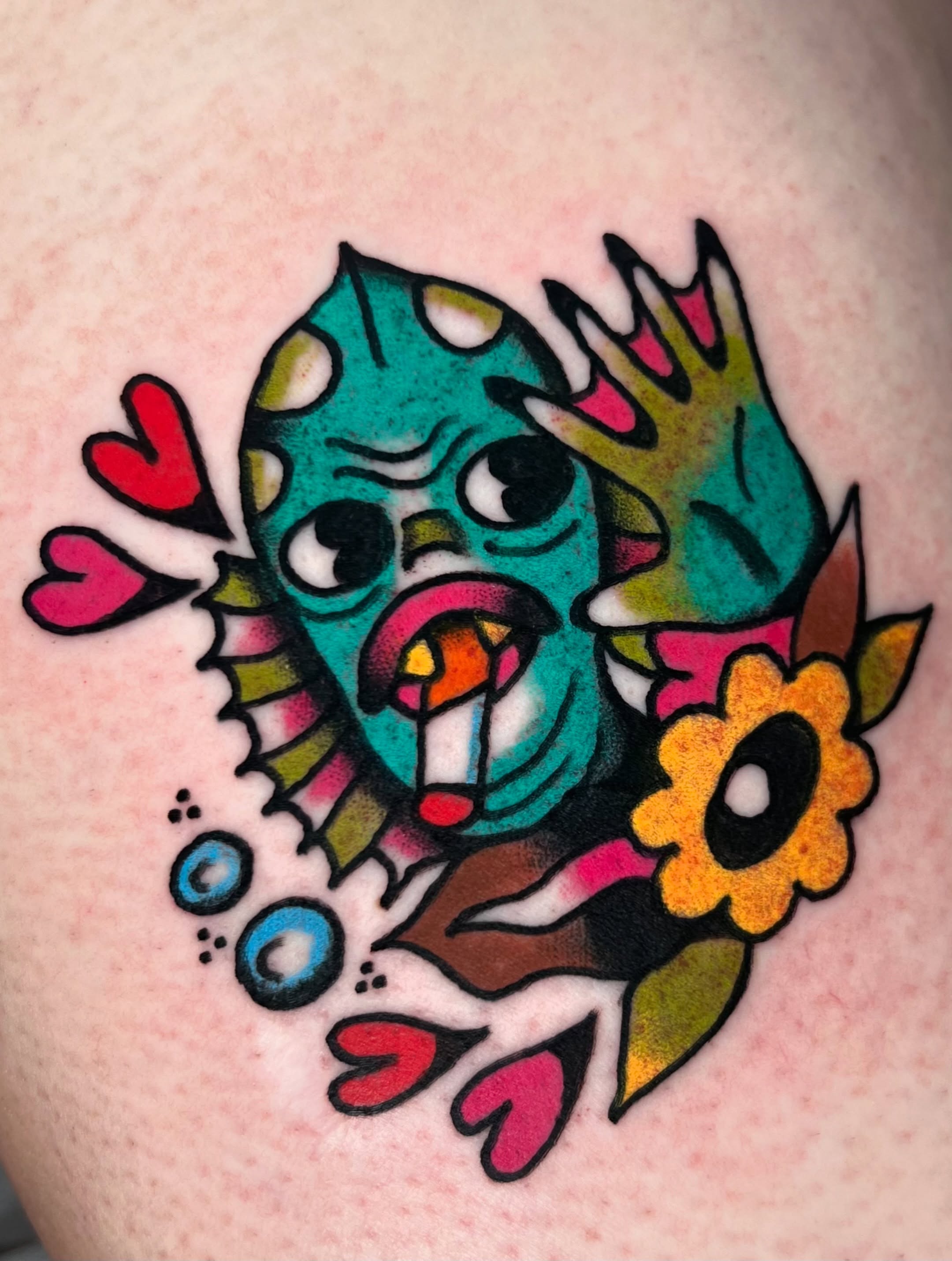 Fish American traditional tattoo on the shoulder by Sierra Mack