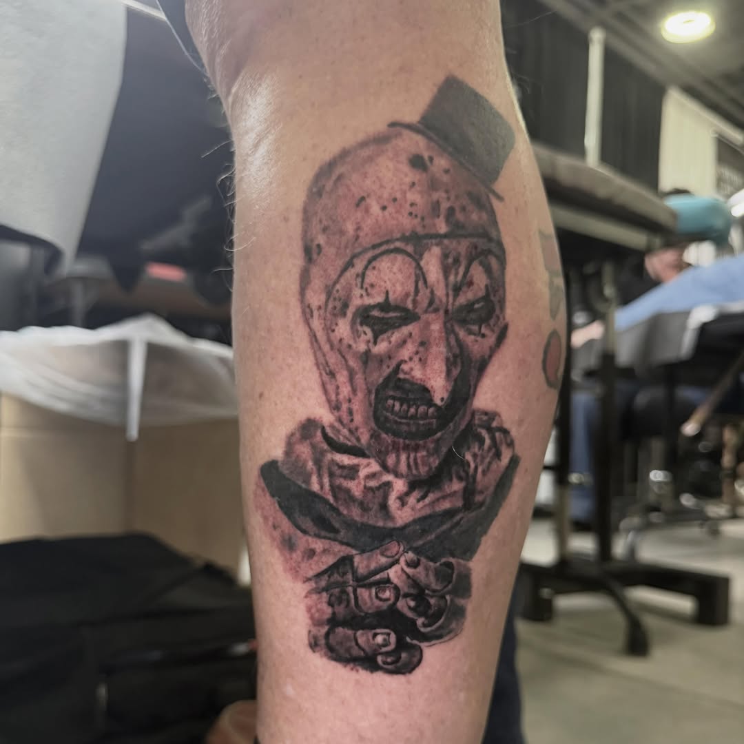 Clown black and grey tattoo on the forearm by Jacob Bettker, Centerville, Ohio