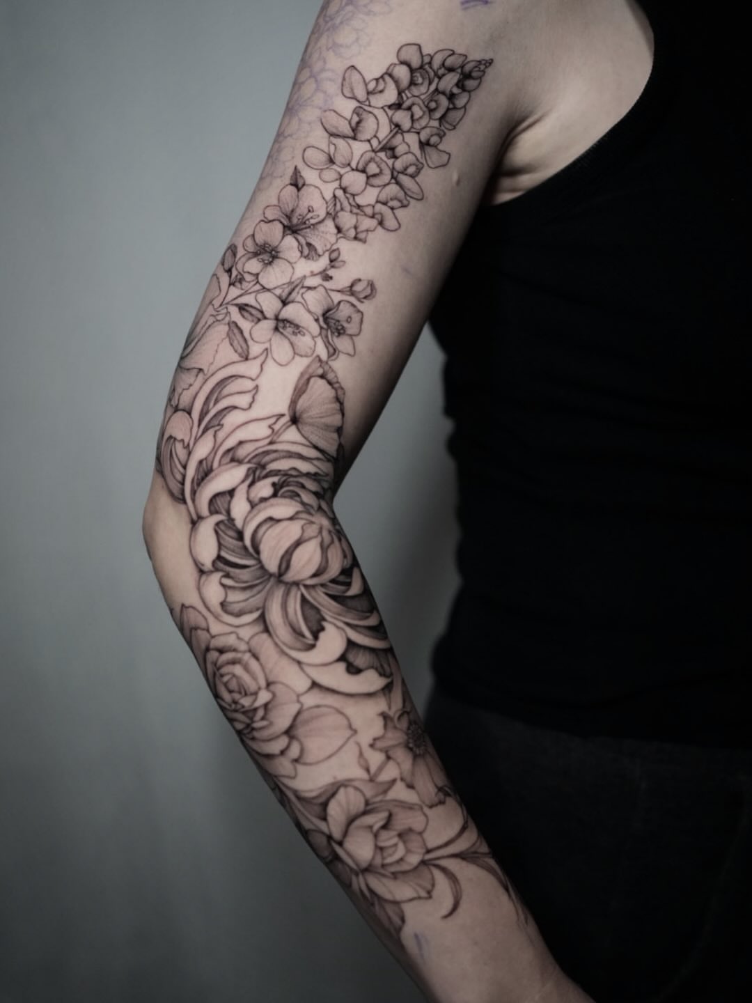 Floral bouquet black and grey tattoo on the forearm by Tattoos by Robyn Pallotta, Austin, Texas