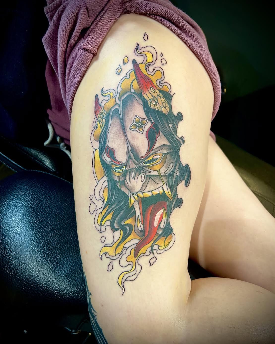 Mask with flames japanese irezumi tattoo on the shoulder by James Brooks
