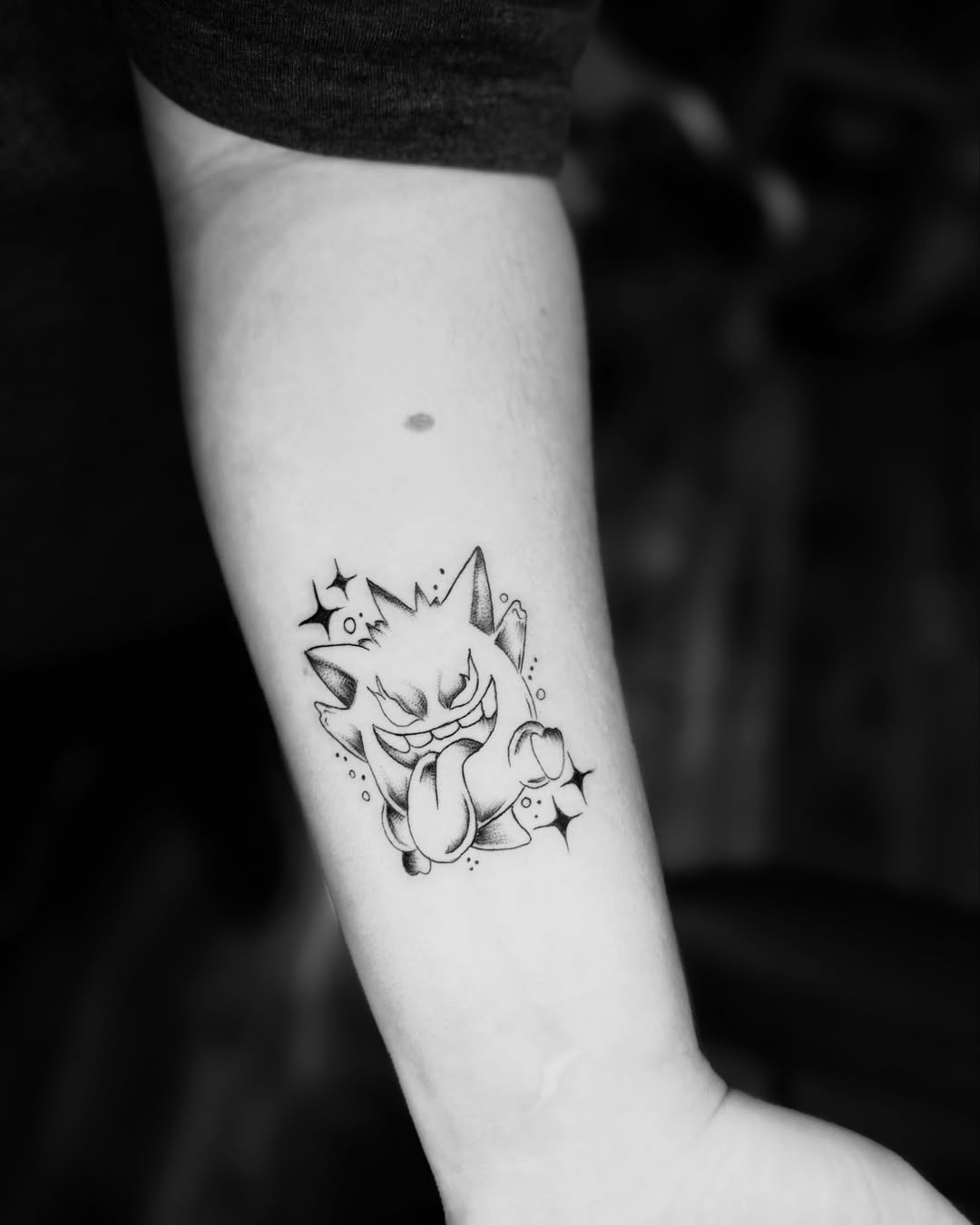 Angry cat black and grey tattoo on the forearm by JAmy Winters