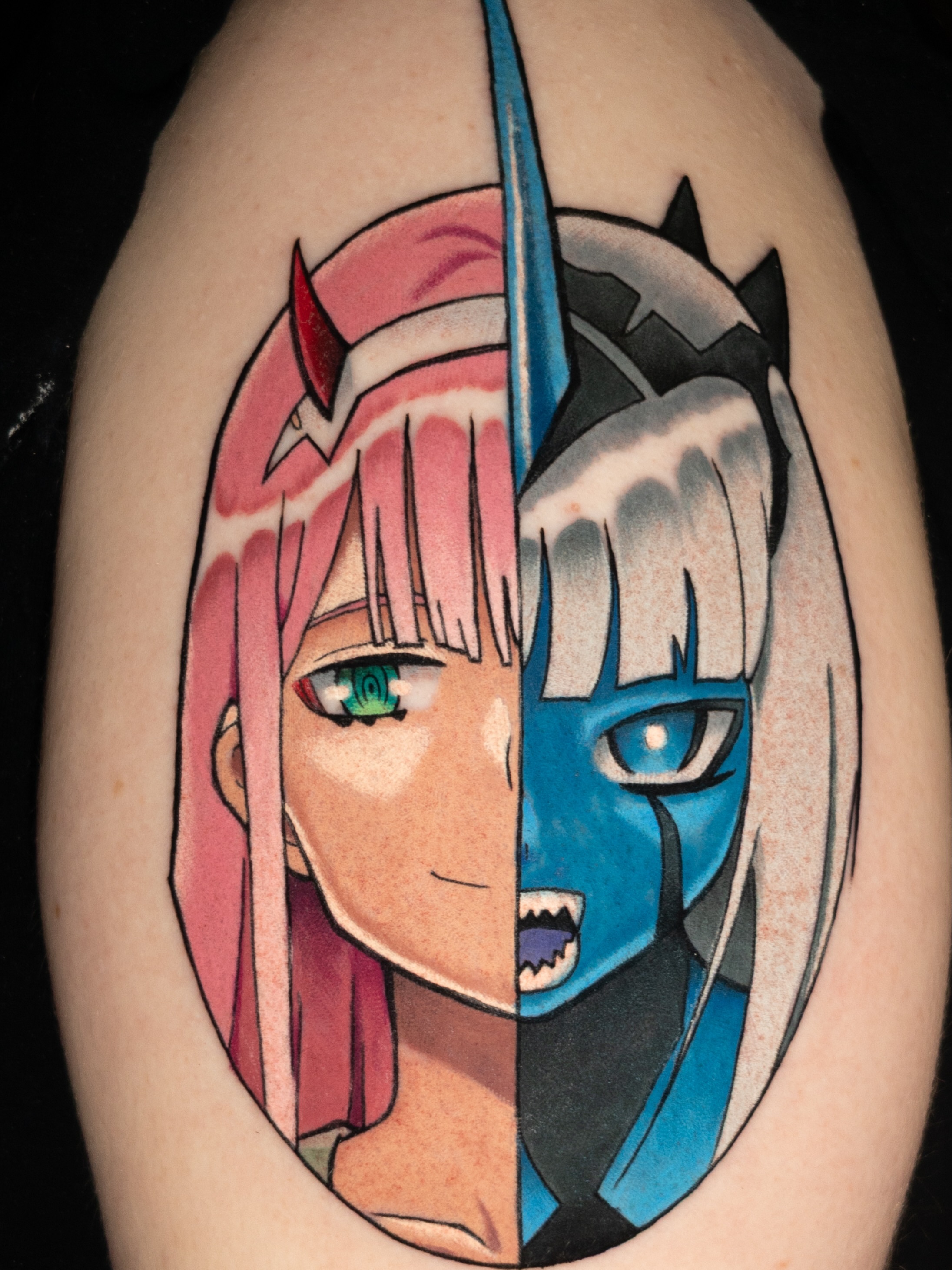Anime characters anime tattoo on the upper arm by Tracci King