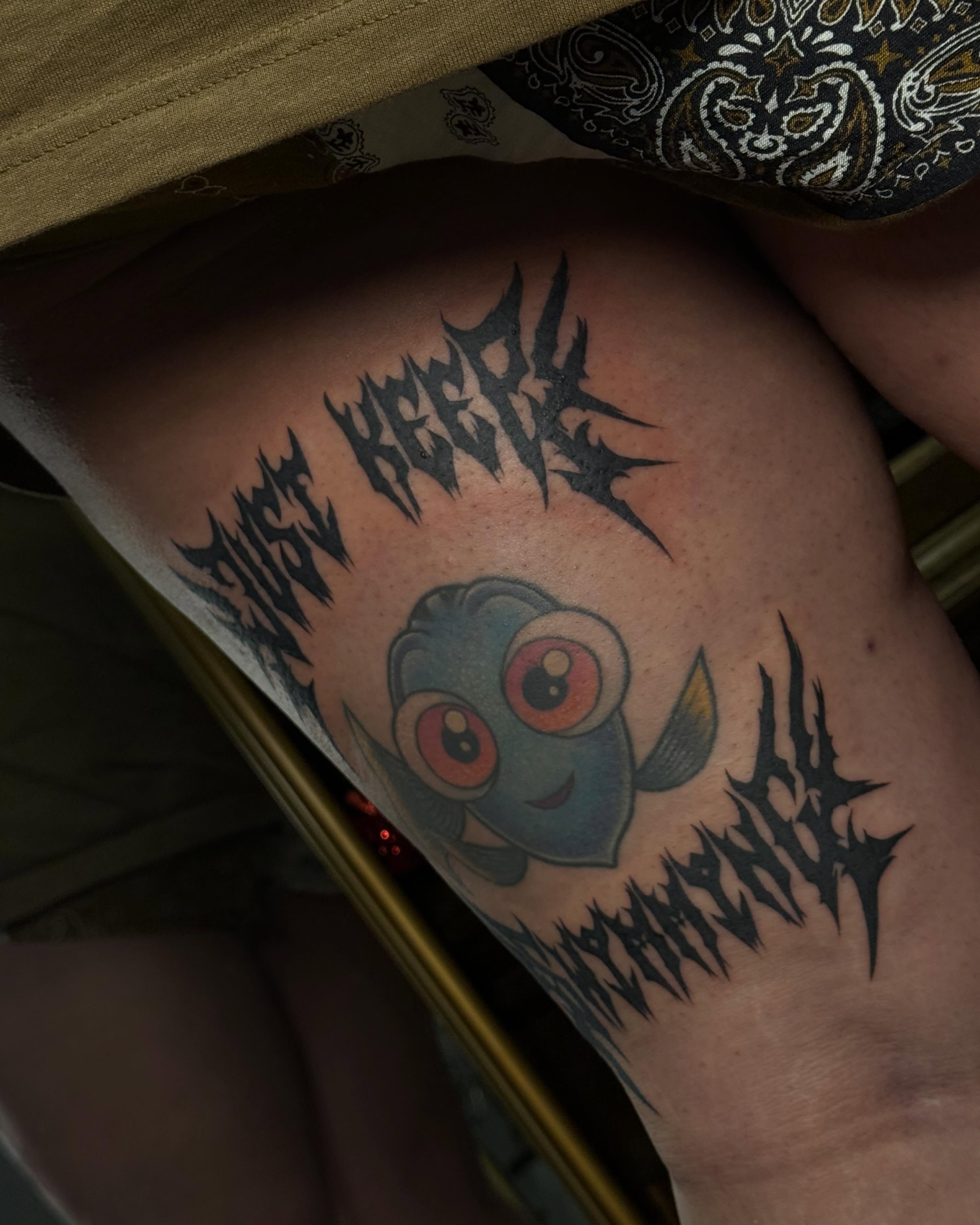 Finding nemo anime tattoo on the thigh by Christian