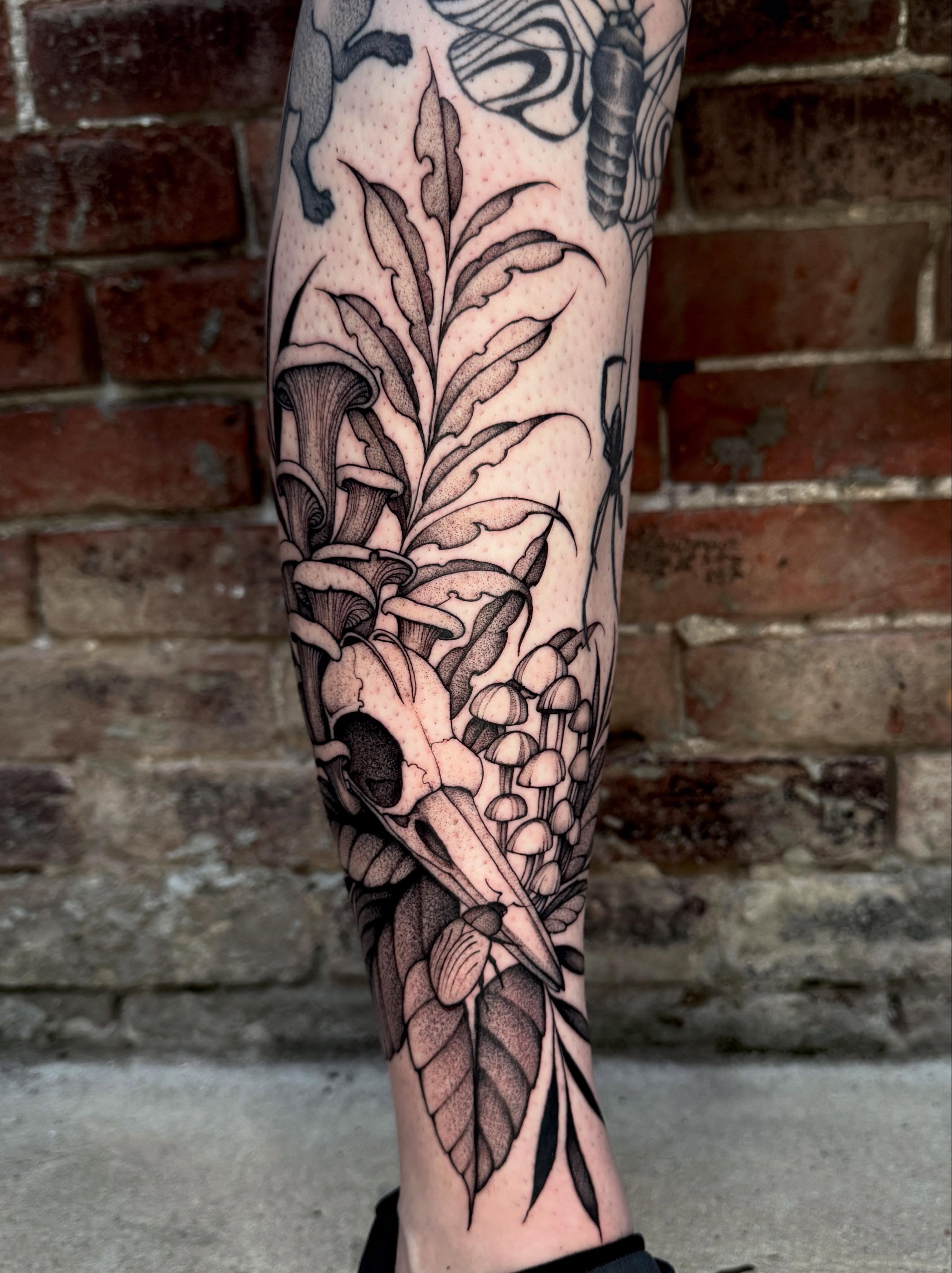 Mushroom and skull dotwork tattoo on the forearm by Lauren Llerandi