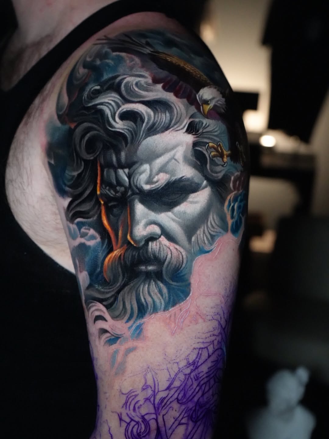 Zeus head with eagle realism tattoo on the forearm by Robert Morton, Cleveland, Ohio