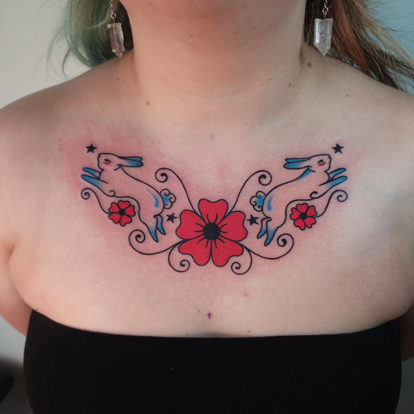 Poppy and rabbits American traditional tattoo on the chest by Maxine Stewart