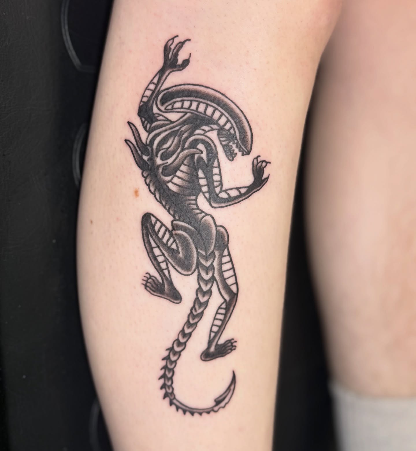 Alien creature black and grey tattoo on the forearm by 🌸Blossom🌸