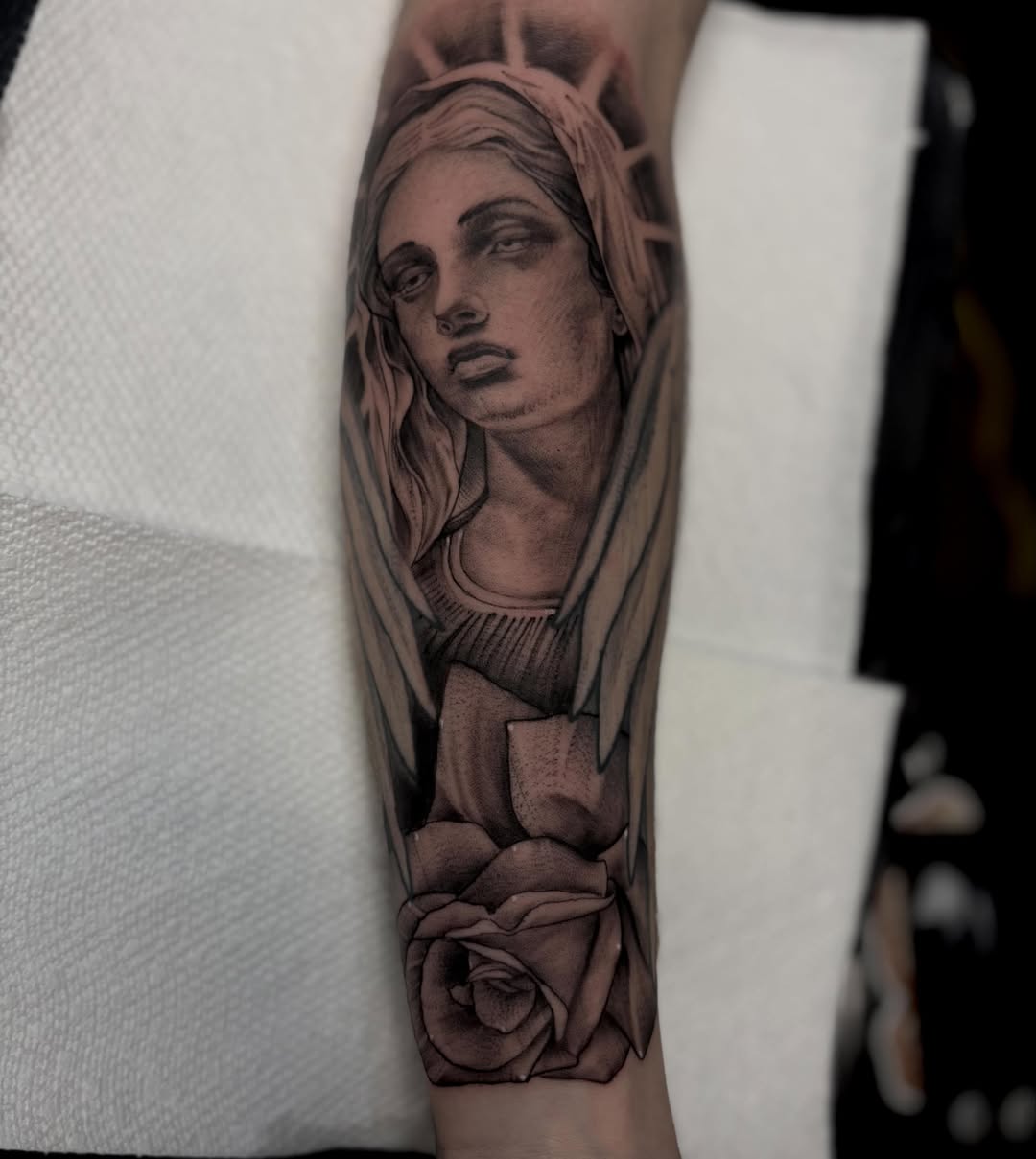 Woman with roses realism tattoo on the forearm by Kyle Ketzler