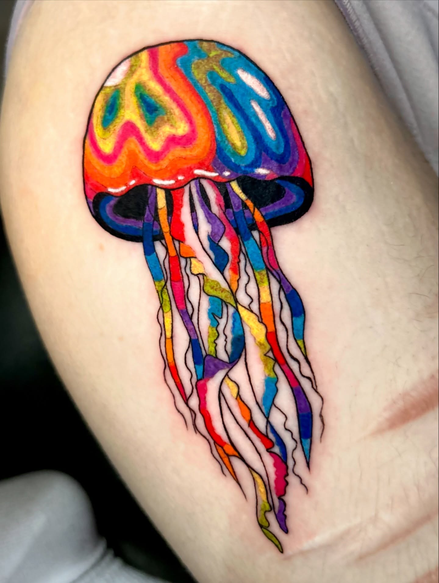 Jellyfish watercolor tattoo on the shoulder by Tess
