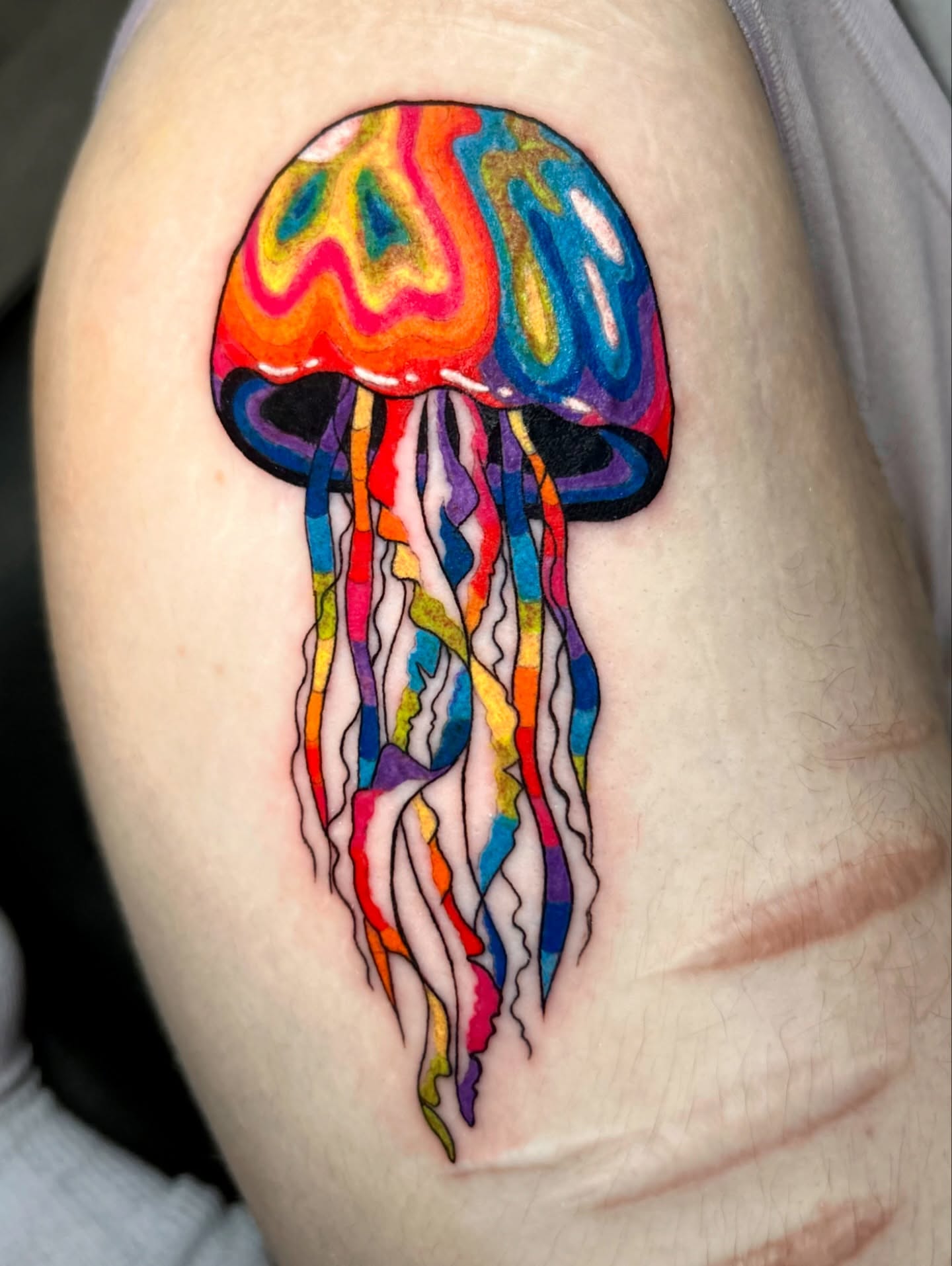 Jellyfish new school tattoo on the shoulder by Tess
