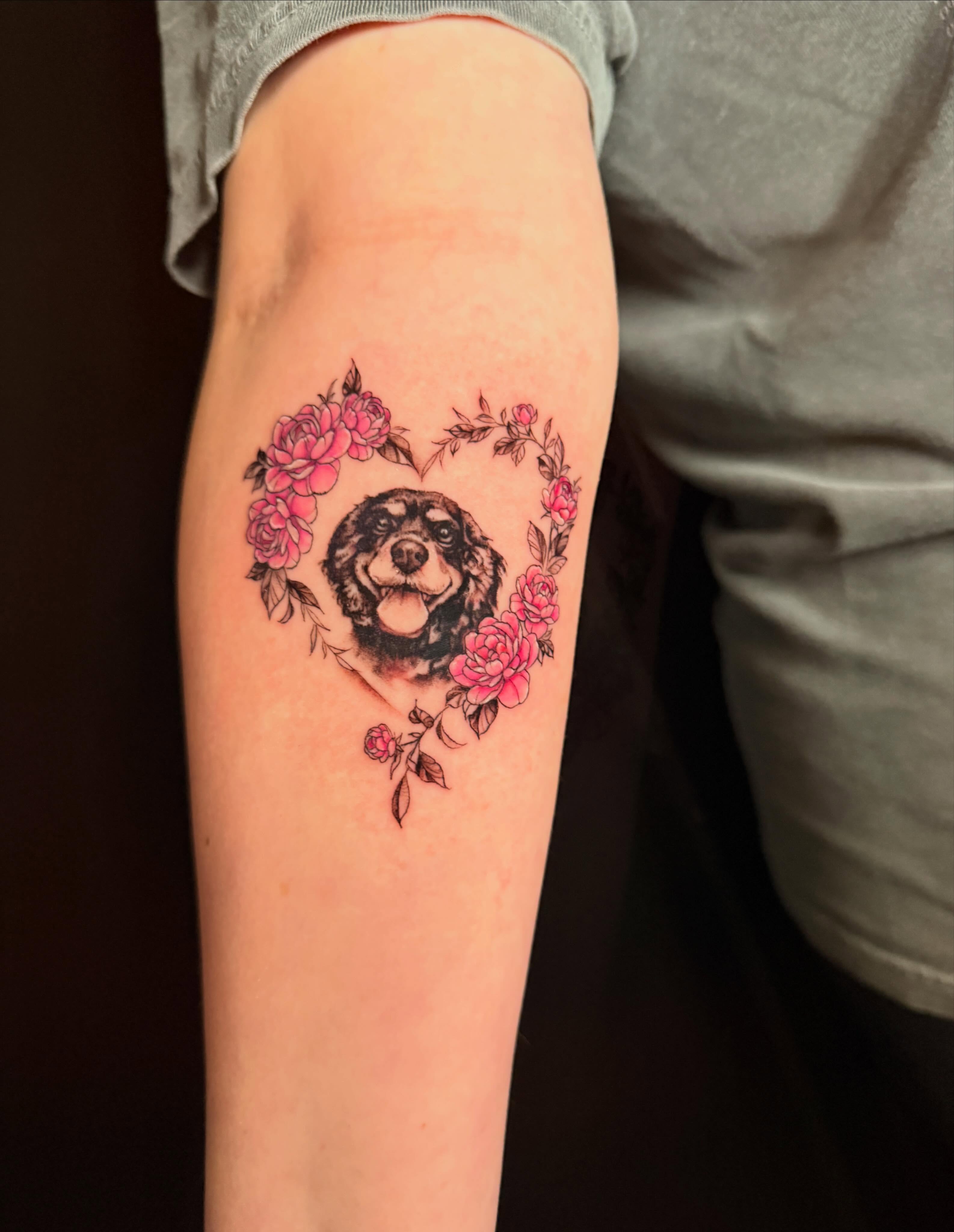 Dog with floral heart realism tattoo on the forearm by Violet Michelle Williams, Charlotte, North Carolina