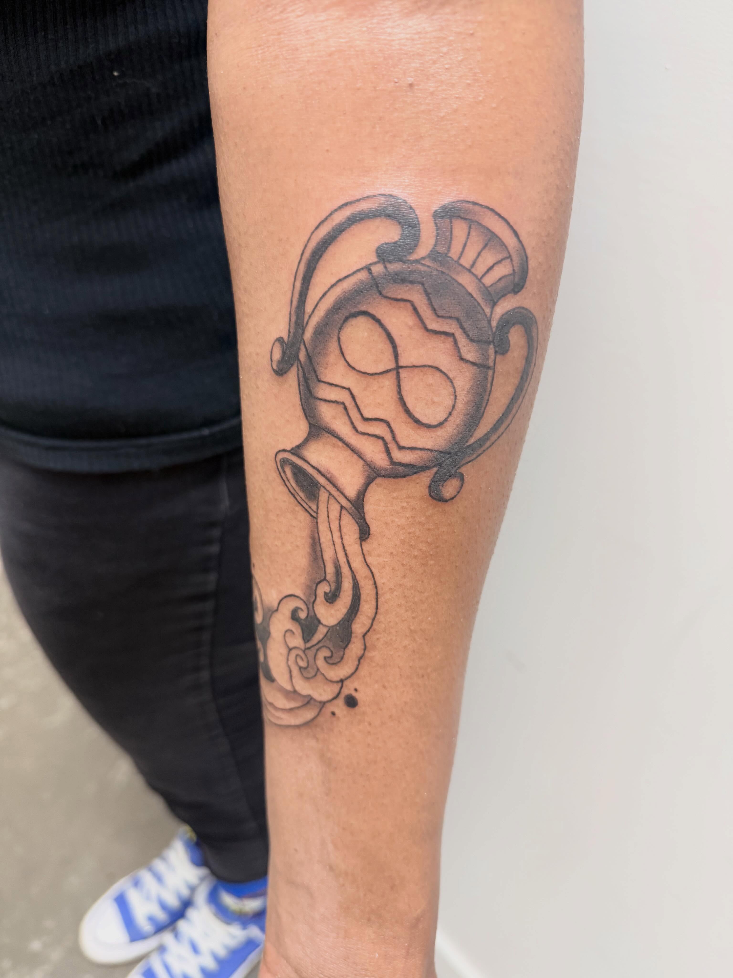Trophy black and grey tattoo on the forearm by Ellari