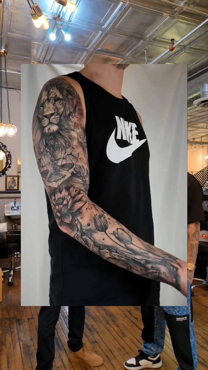 Lion and skull sleeve realism tattoo by 𝗔𝗟𝗘𝗫 𝗣𝗥𝗘𝗤𝗨𝗘𝗟 𝗧𝗔𝗧𝗧𝗢𝗢𝗦 𝗖𝗛𝗜𝗖𝗔𝗚𝗢 ™, Chicago, Illinois
