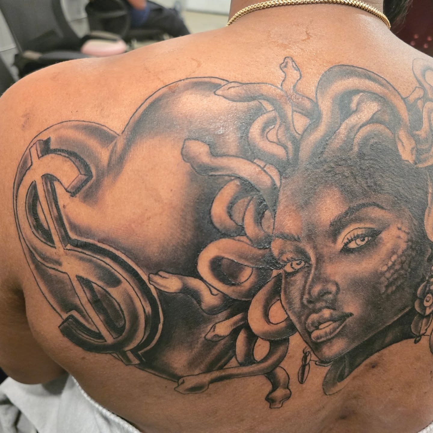 Medusa head realism tattoo on the back by Klazzik Mayfield, Fort Lauderdale, Florida